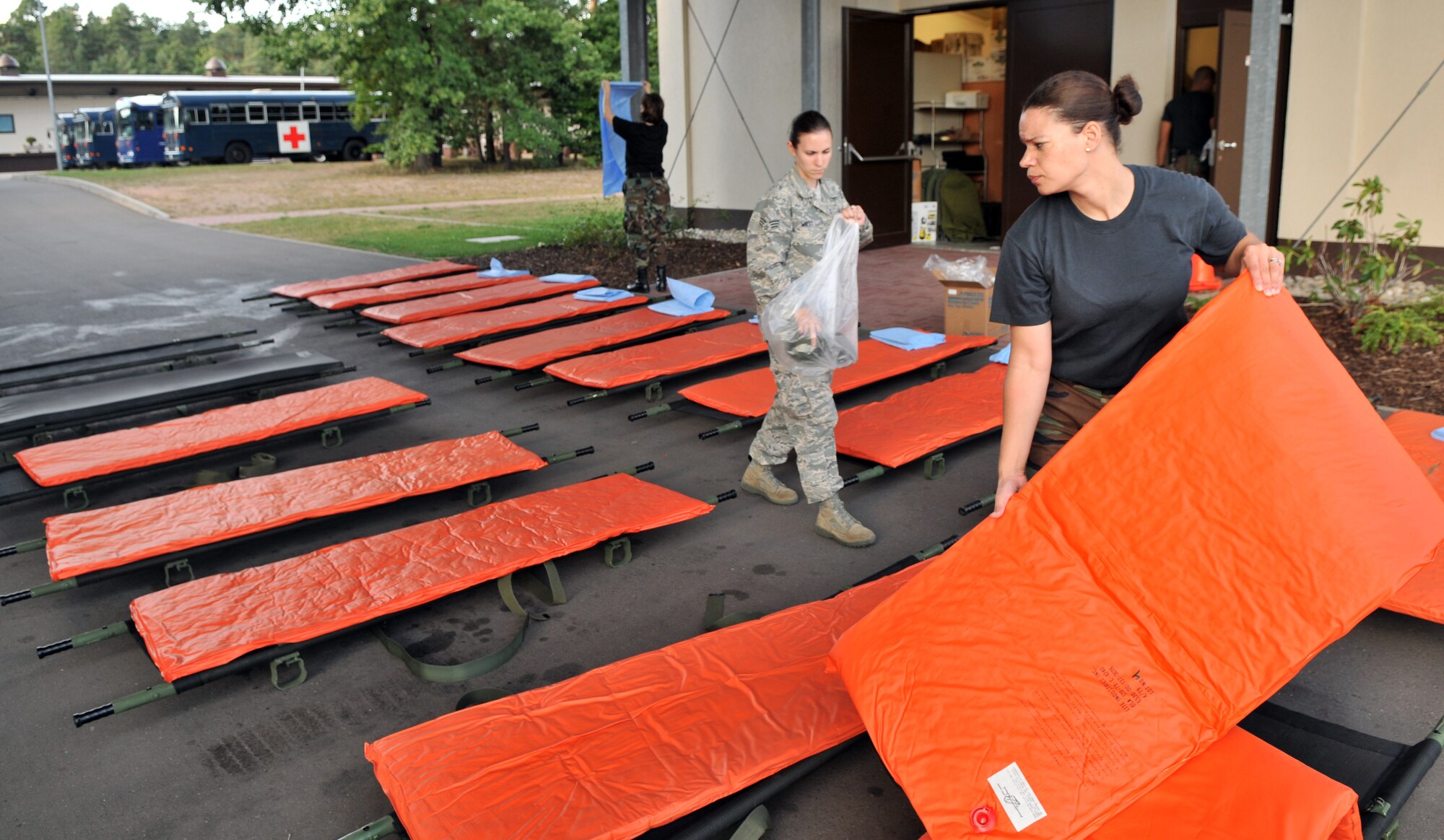 U.S. Air Force Tech. Sgt. Laura Small, 86th Contingency Aeromedical Staging Facility medical technician, places mats on gurneys, Ramstein Air Base, Germany, Aug. 27, 2009. The gurneys will be used to transport wounded warriors to an aircraft taking them to Walter Reed Army Medical Center for further medical treatment. (U.S. Air Force photo by Senior Airman Nathan Lipscomb)