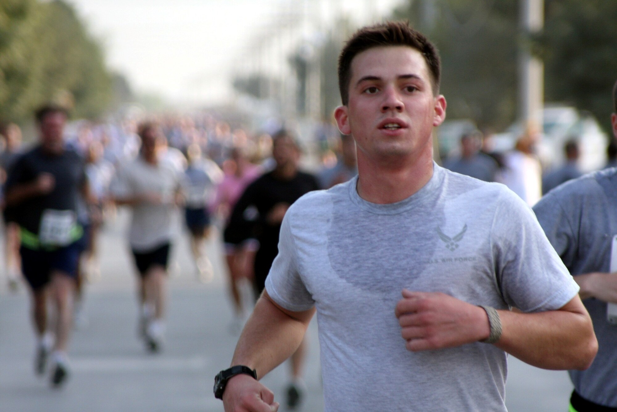 BAGRAM AIRFIELD, Afghanistan  – An Airman closes in on the finish line while participating in a 9.11 kilometer run to honor fallen comrades in the wars in Iraq and Afghanistan, as well as those killed in the Sept. 11 terrorist attacks. (U.S. Army photo/Capt. Michael Greenberger) 