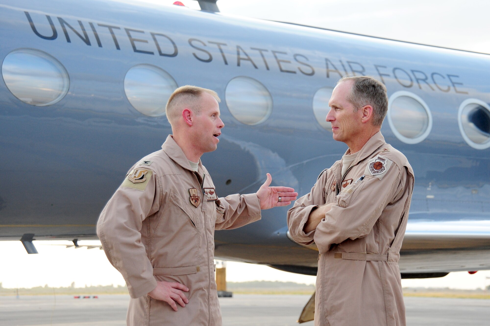 TRANSIT CENTER AT MANAS, Kyrgyzstan -- Lt. Gen. Mike Hostage, U.S. Air Force Central Command commander, and Col. Blaine Holt, 376th Air Expeditionary Wing commander, engage in conversation on the flightline at the Transit Center. General Hostage visited the Transit Center at Manas for the first time as AFCENT commander. He toured several facilities at Manas and shared his time with Airmen stationed here. (U.S. Air Force photo/Senior Airman Steele C. G. Britton)