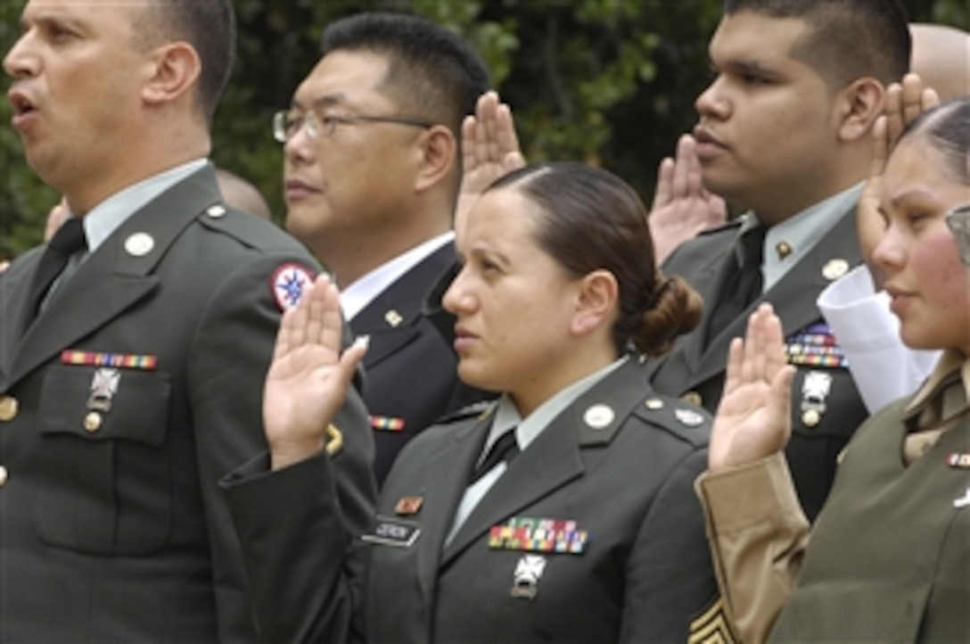 Thirty-one military personnel stood before friends and family during a military naturalization ceremony and gained their citizenship in the Pentagon Courtyard on Sept. 10, 2009.  