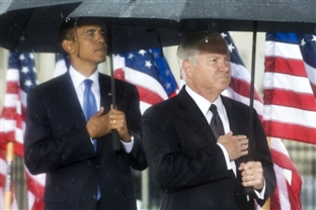 President Barack Obama and Defense Secretary Robert M. Gates participate in a 9/11 commemoration ceremony at the Pentagon, Sept. 11, 2009. It marks the eighth anniversary of the terrorist attacks that killed 59 passengers onboard hijacked American Airlines flight 77, which crashed into the Pentagon to kill 125 inside.