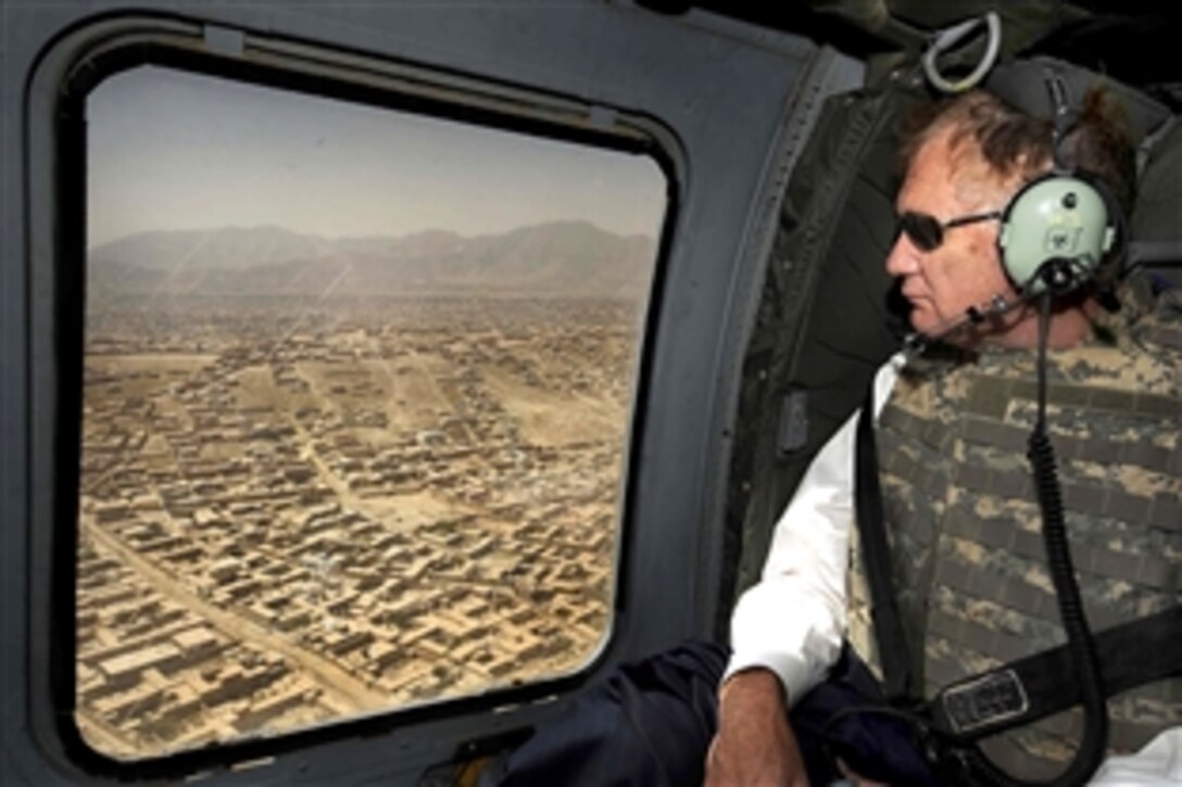 U.S. Deputy Defense Secretary William J. Lynn III looks at homes and terrain surrounding Kabul, during an aerial tour on a Army UH-60 Blackhawk helicopter, Sept. 9, 2009. It was Lynn's first trip to Southwest Asia since he was confirmed as deputy secretary.