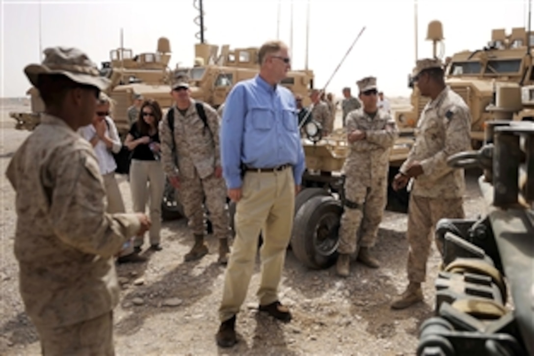 U.S. Deputy Secretary of Defense William J. Lynn III receives a tour of mine-resistant, ambush-protected vehicles on Camp Leatherneck on Field Operating Base Bastion,  Afghanistan, Sept. 10, 2009.