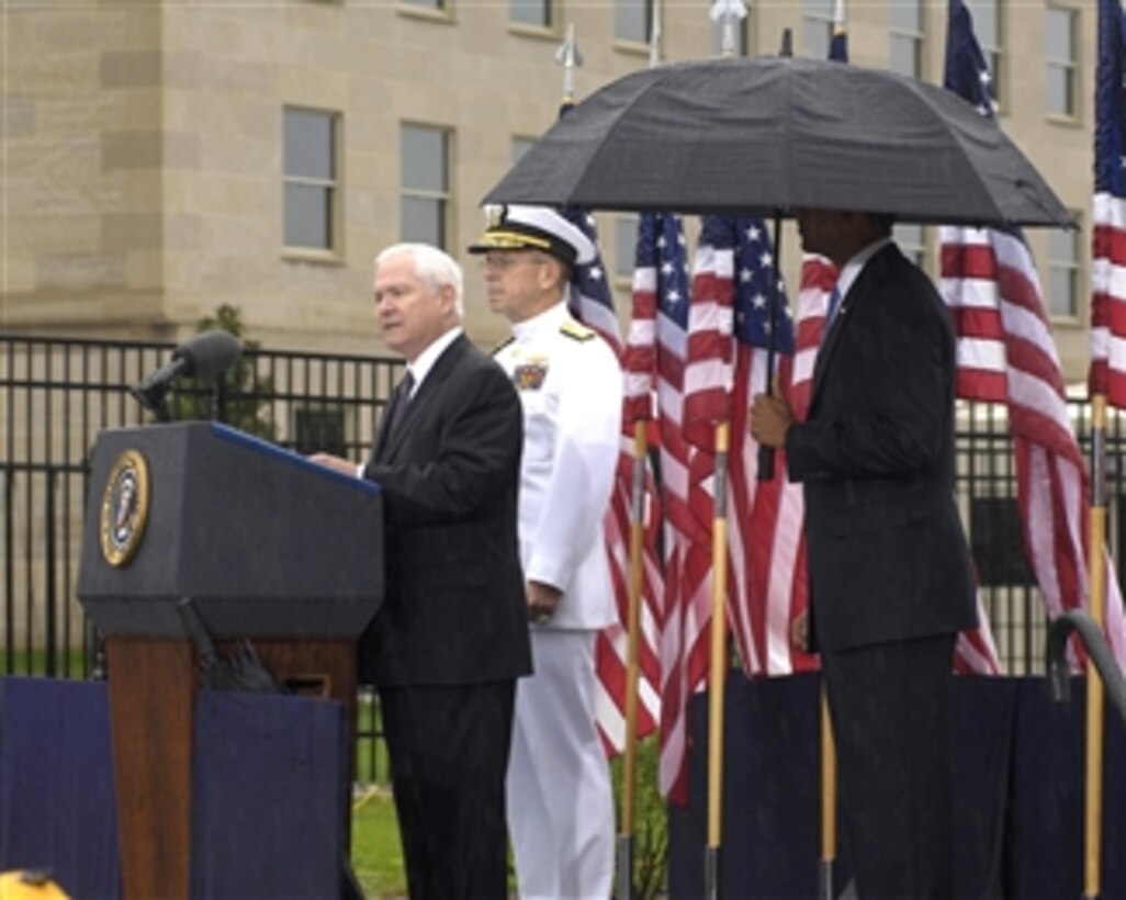Secretary of Defense Robert M. Gates delivers remarks at a memorial observance marking the 8th anniversary of the 2001 terrorist attack on the Pentagon held at the Pentagon Memorial on Sept. 11, 2009.  Joining Gates for the commemoration are President Barack Obama (right) and Chairman of the Joint Chiefs of Staff Adm. Mike Mullen (2nd from left), U.S. Navy.  