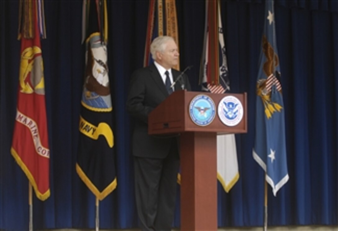 Secretary of Defense Robert M. Gates delivers remarks during a military naturalization ceremony where 31 military members stood in front of family and friends in the Pentagon Courtyard and received their U.S. citizenship on Sept. 10, 2009.  
