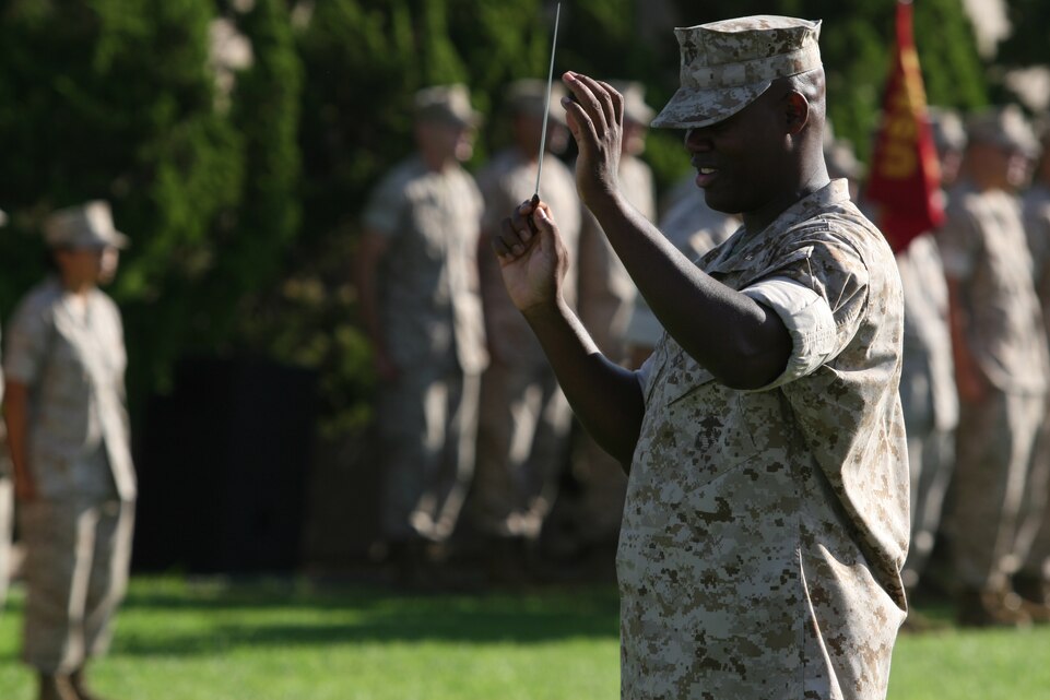 Chief Warrant Officer 2 Edward Hayes, the director of the 3rd Marine Aircraft Wing Band, directs the band at Marine Corps Air Station Miramar's colors ceremony Sept. 11. The band played several songs during the ceremony.