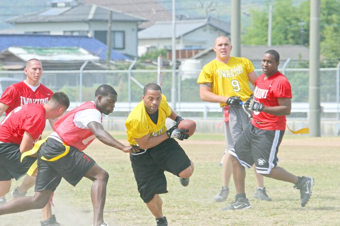 Headquarters and Headquarters Squadron running back Gregory Joseph runs for a big gain during the 2009 Fall Classic football game held at the Northside football field here Sept. 11. Joseph was named the game’s most valuable player.