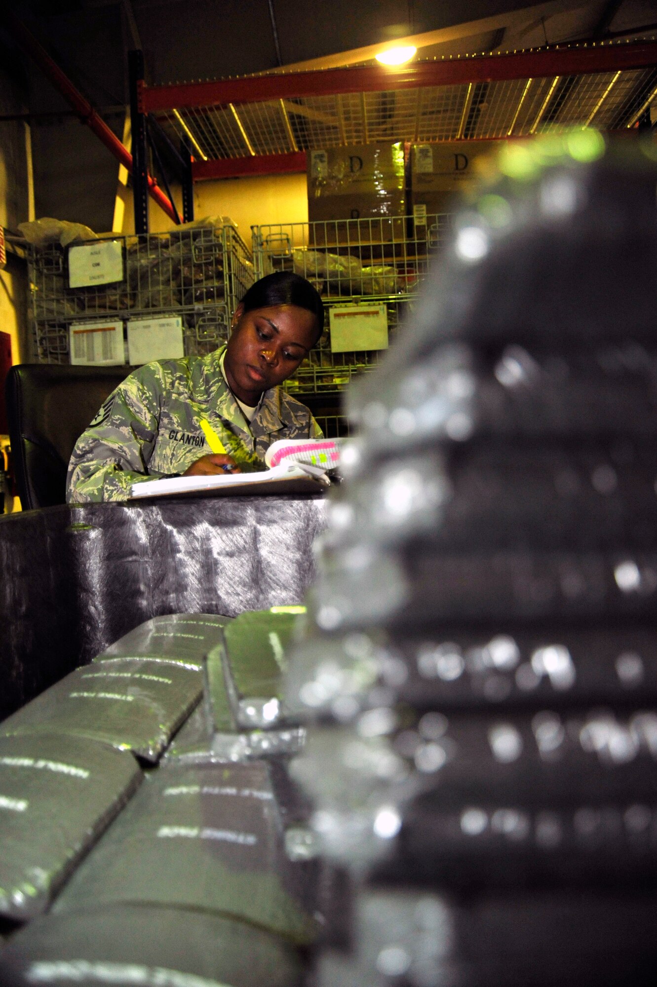 SOUTHWEST ASIA -Staff Sgt. Shandeka Glanton, 380th Expeditionary Logistics Readiness Squadron, accounts for each body armor plate Sept. 12, 2009. Sergeant Glanton is deployed from MacDill Air Force Base, Fla., and grew up in Baton Rouge, La. (U.S. Air Force photo/Tech. Sgt. Charles Larkin Sr)