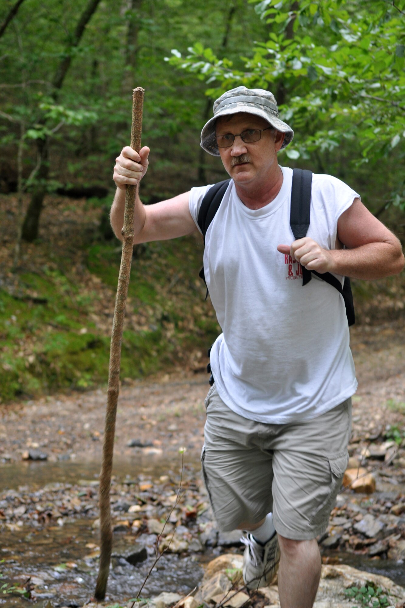 Technical Sgt. Jeff Walston, 917th Wing, public affairs technician, takes a nature hike in Arkansas’ Ouachita National Forest, Sept. 6, 2009. Sergeant Walston was attending the 2nd Annual Un-Official 917th Wing Public Affairs Retreat, which is used to relieve stress, boost morale and build a sense of team cohesiveness within the public affairs office. This was Sergeant Walston’s first year to attend the retreat. (Photo by Greg Steele)