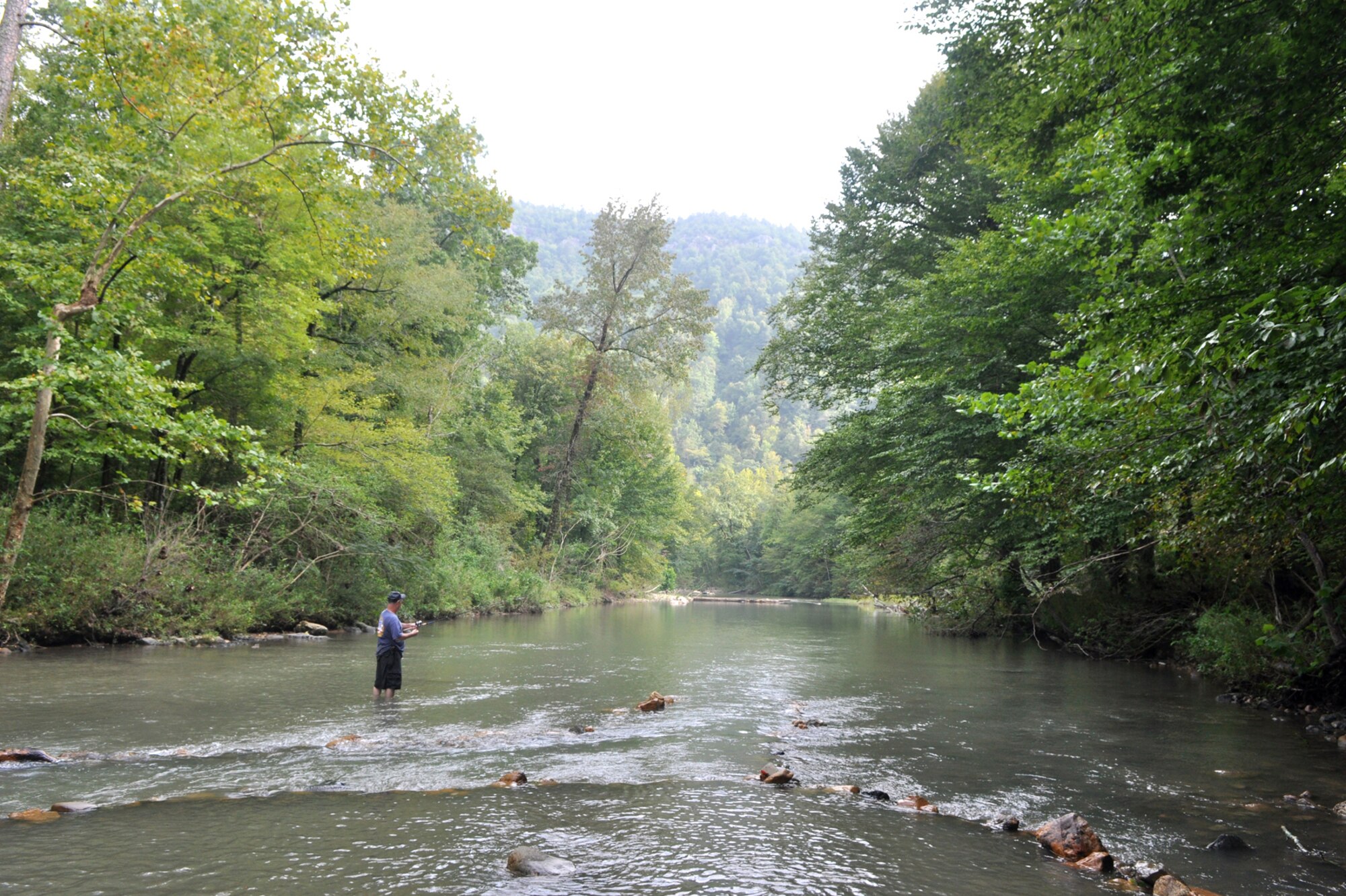 Technical Sgt. Jeff Walston, 917th Wing, public affairs technician, takes in the beauty of the Ouachita National Forest, Sept. 5, 2009 while fishing on the Little Missouri River in Arkansas’ Sergeant Walston was attending the 2nd Annual Un-Official 917th Wing Public Affairs Retreat, which is used to relieve stress, boost morale and build a sense of team cohesiveness within the public affairs office. (Photo by Greg Steele)