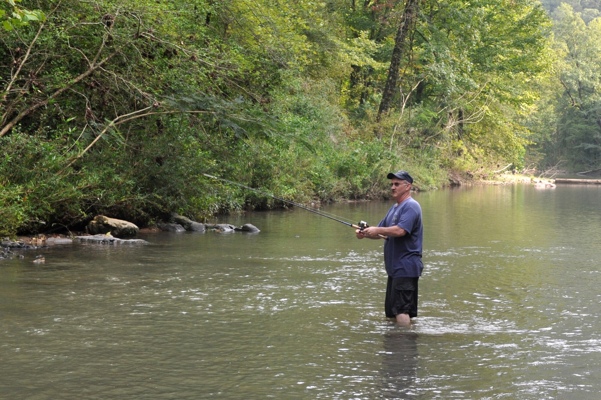 Technical Sgt. Jeff Walston, 917th Wing, public affairs technician, attempts to catch a world record fish on the Little Missouri River in Arkansas’ Ouachita National Forest, Sept. 5, 2009. Sergeant Walston was attending the 2nd Annual Un-Official 917th Wing Public Affairs Retreat, which is used to relieve stress, boost morale and build a sense of team cohesiveness within the public affairs office. This was Sergeant Walston’s first year to attend the retreat. (Photo by Greg Steele)