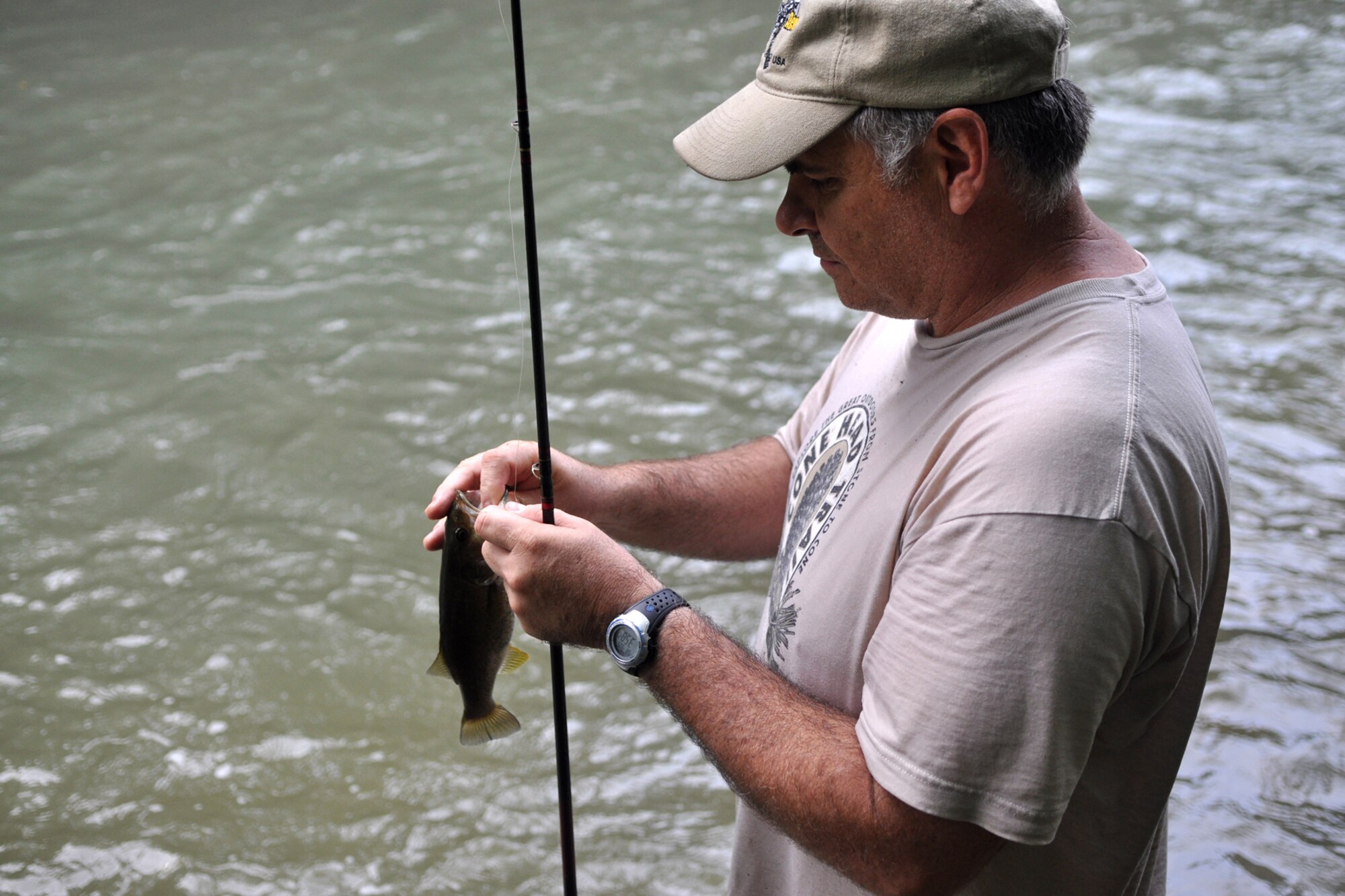 Master Sgt. Greg Steele, visual information specialist, 47th Fighter Squadron, observes the catch and release program on the Little Missouri River in Arkansas’ Ouachita National Forest, Sept. 5, 2009. Sergeant Steele was attending the 2nd Annual Un-Official 917th Wing Public Affairs Retreat, which is used to relieve stress, boost morale and build a sense of team cohesiveness within the public affairs office.  (Photo by Jeff Walston)