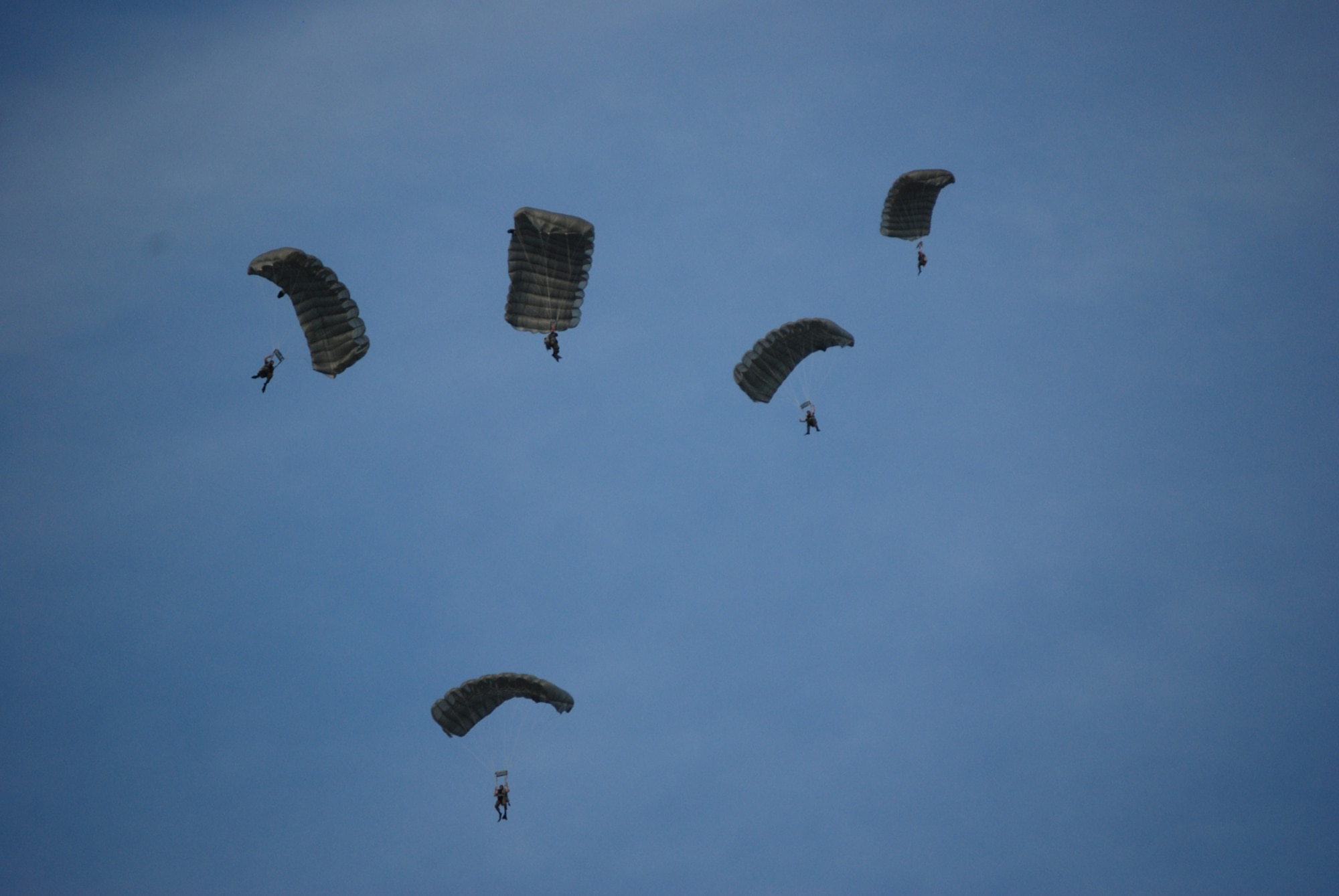 COCOA BEACH, Fla. -- Air Force Reserve Pararescuemen from the 308th Rescue Squadron parachute into a landing zone established in the Atlantic Ocean off Cocoa Beach as part of a ceremony honoring military men and women, both past and present from the area during a ceremony held Sep. 11 at a local restaurant on Cocoa Beach. The 920th Rescue Wing conducted a Search and Rescue operation involving Pararescuemen parachuting from unit-equipped HC-130P/N aircraft into the ocean and a rescue operation with the unit's HH-60G Pave Hawk helicopter which also performed during a air-to-air refueling demonstration with the HC-130P/N. The 920th Rescue Wing will conduct similar capability demonstrations during the Cocoa Beach air show scheduled for October 2-4 at Alan Shepard Park along Highway A1A in. U.S. Air Force photo/Master Sgt. Bryan Ripple