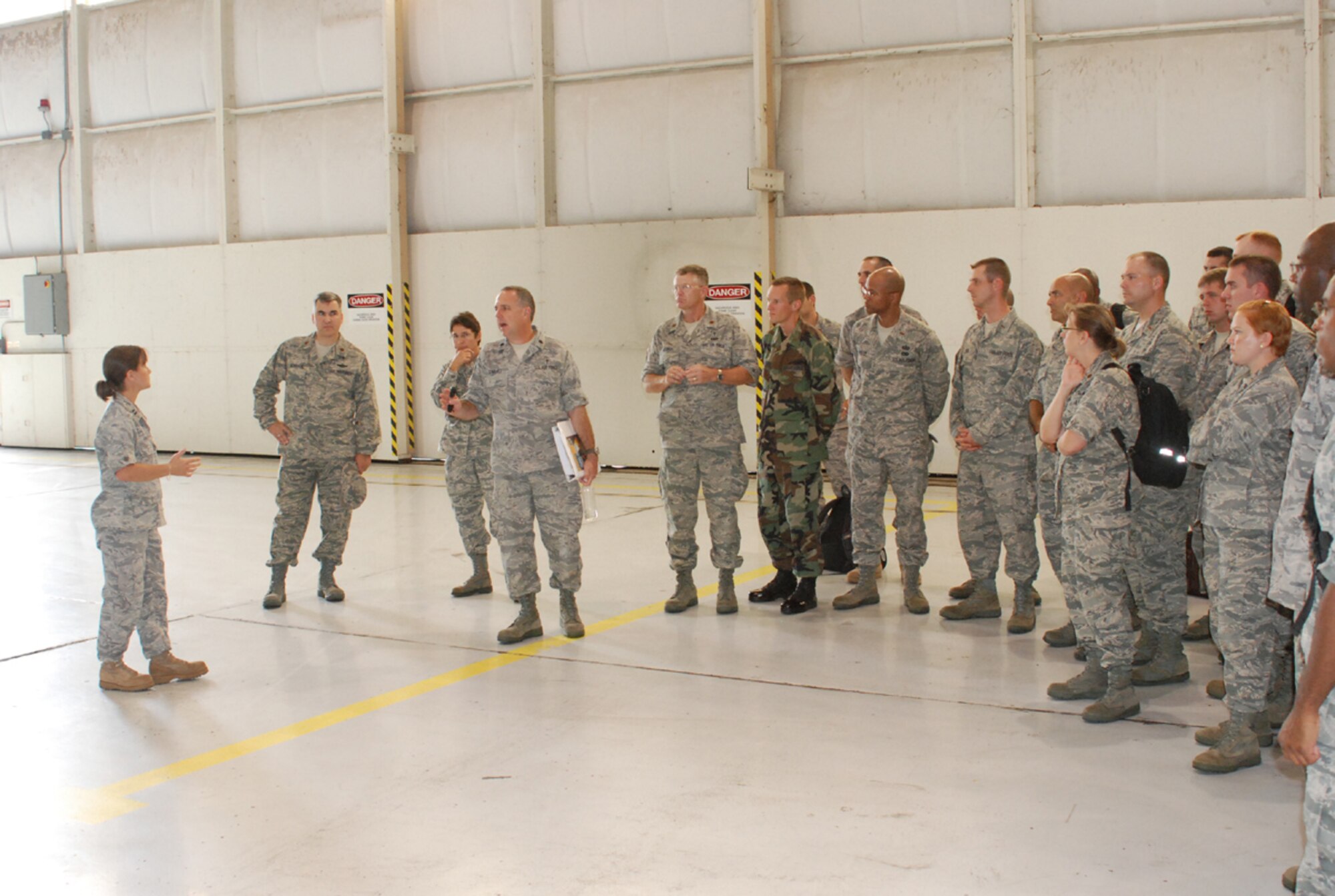 Captain Eileen Frock, with 301st Maintenance Squadron, briefs potential new Air Force Reserve Chaplains on the basics of an Air Force F-16 maintenance here during the Chaplain Candidate tour August 2. (U.S. Air Force photo/TSgt Stephen C. Bailey)