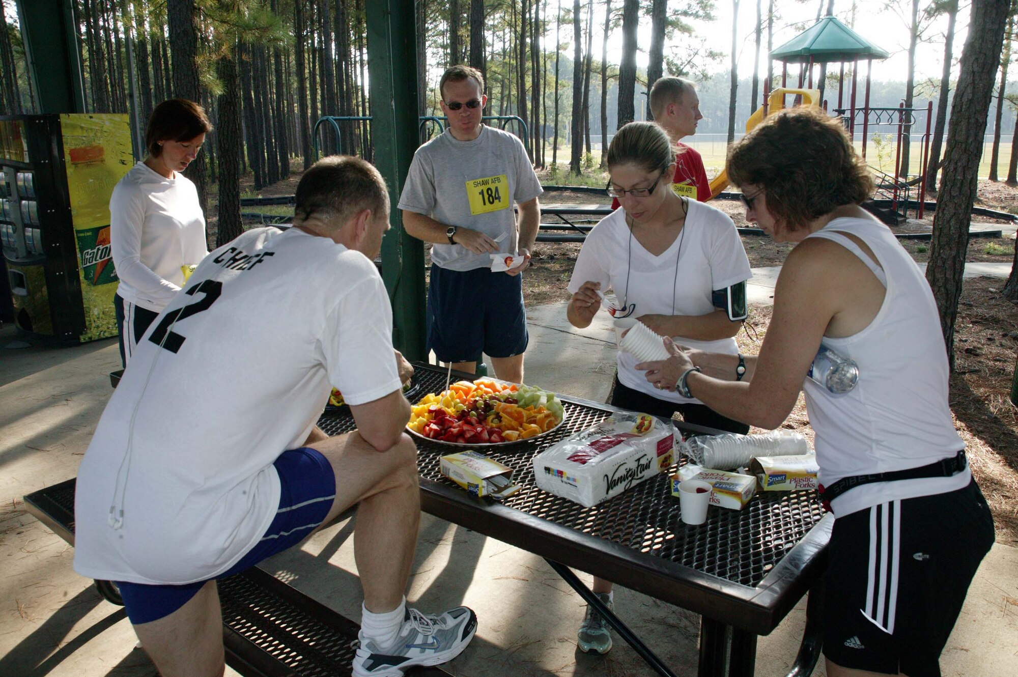 SHAW AIR FORCE BASE, S.C. -- Participants in Shaw's 5th Annual Half-Marathon Race enjoy some refreshments and food after the race Sept. 12. The 13.1-mile half marathon was hosted by the fitness center to promote healthy living and 'fit-to-fight' standards. First-place winner overall was Lt. Col. Ken Ekman, 79th Fighter Squadron commander. (U.S. Air Force photo/Staff Sgt. John Gordinier)