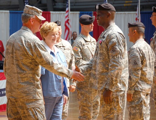Maj. Gen. Thaddeus Martin, the adjutant general, Conn. National Guard and M. Jodi Rell, governor of Conn., congratulate and welcome home Capt. Donald Chiverton from the 1109th Aviation Classification Repair Activity Depot during the Freedom Salute Ceremony on Aug. 16, 2009 at the William A. O’Neil Armory in Hartford, Conn. Capt. Chiverton received the Meritorious Service Medal for distinguished service while deployed overseas. (U.S. Air Force photo by Tech. Sgt. Joshua Mead)
