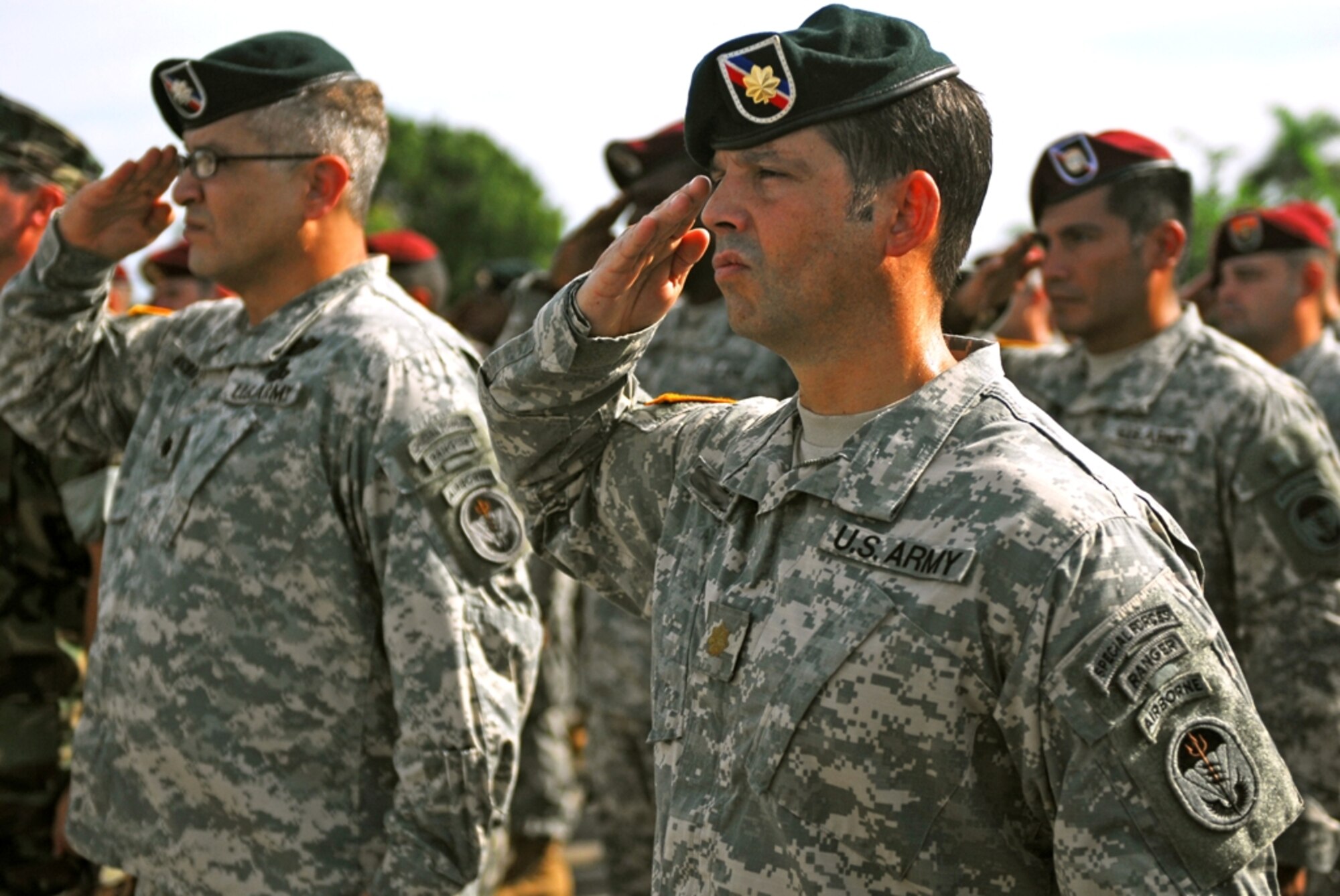 A Special Operations Command South Soldier salutes the U.S. Flag as it is lowered to half mast during a 911 memorial ceremony in Homestead ARB, FL. (U.S. Army Photo by Sgt. 1st Class Felix A. Figueroa, SOCSOUTH PAO)
