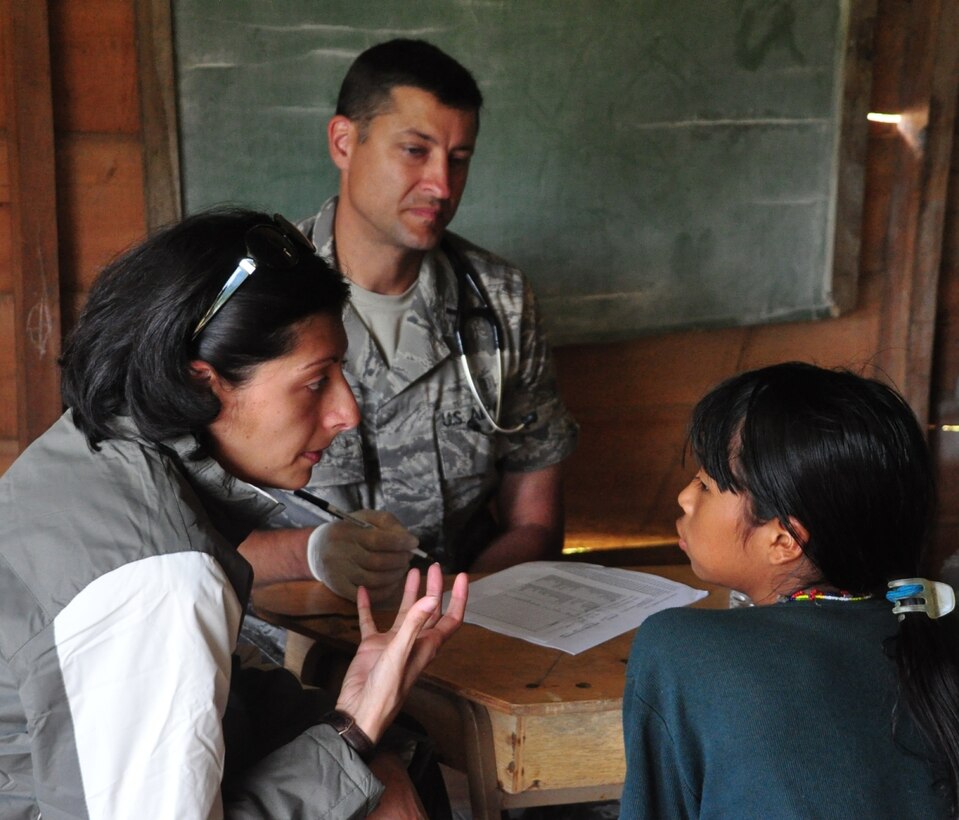 TOLOKICHA, Costa Rica — Air Force 1st Lt. Adam Bailey and Tatiana Serrano examine patients here Sept. 11 as part of a two-day Medical Readiness and Training Exercise in remote areas of that nation. More than 30 personnel from JTF-Bravo and the Ministry of Health teamed up to offer care to members of this remote area. Lieutenant Bailey is a physician's assistant assigned to JTF-Bravo's Medical Element, while Ms. Serrano served as a translator from the U.S. Military Group at the U.S. Embassy in San Jose, Costa Rica (U.S. Air Force photo/Tech. Sgt. Mike Hammond).