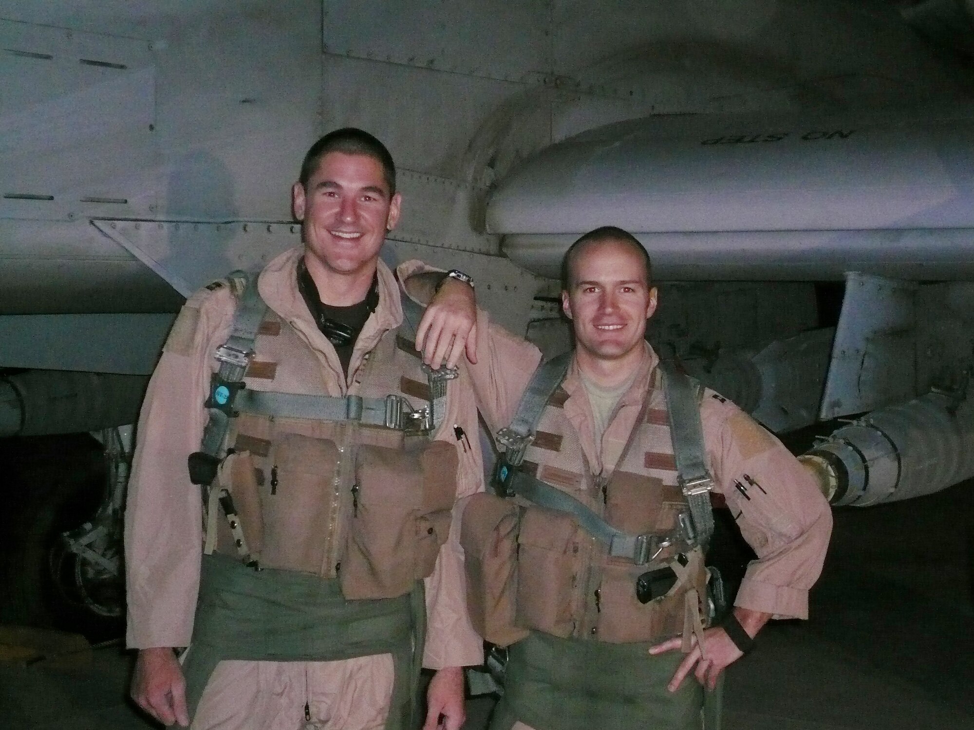 Captains Douglas Witmer (left) and Andrew Wood (right), 354th Expeditionary Fighter Squadron A-10 pilots, reached a milestone of 1,000 flight hours Sept. 11.  Both are stationed at Davis-Monthan Air Force Base, Ariz. and are deployed to Kandahar Airfield, Afghanistan in support of Operation Enduring Freedom and Combined Joint Task Force Afghanistan missions. (U.S. Air Force photo/Capt. Joe Shetterly)