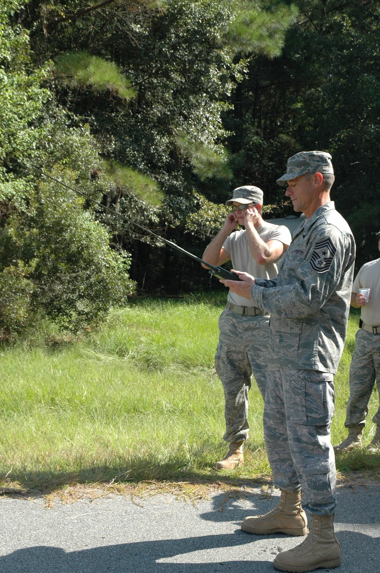 315th Airlift Wing Command Chief Master Sgt. Ben Futrell detonates an explosive alongside Staff Sgt. Johnathan Sheridan, an Explosive Ordinance Disposal Technician with the 315th Civil Engineering Flight, at Charleston Air Force Base, S.C., Sept. 12. Command leadership decided to participate in the required demolitions training to experience a few aspects of what it means to be an EOD technician. (U.S. Air Force photo by Senior Airman Dani Pacheco)