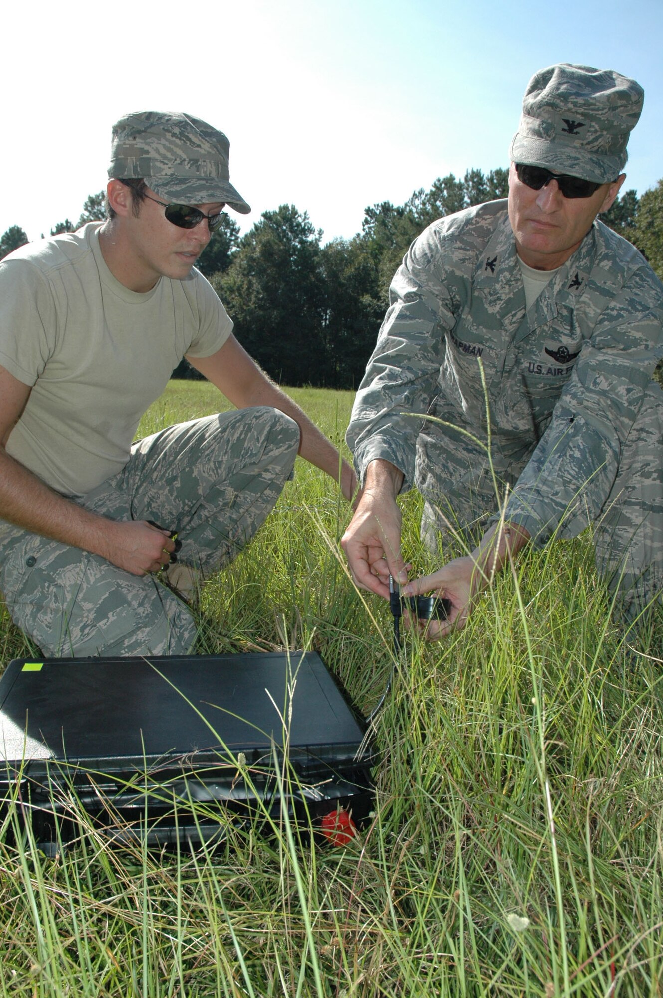 315th Airlift Wing Commander Col. Steven Chapman primes a charge on a British 'boot banger' explosive with the assistance of Staff Sgt. Johnathan Sheridan, an Explosive Ordinance Disposal Technician with the 315th Civil Engineering Flight, at Charleston Air Force Base, S.C., Sept. 12. Command leadership decided to participate in the required demolitions training to experience a few aspects of what it means to be an EOD technician. (U.S. Air Force photo by Senior Airman Dani Pacheco)