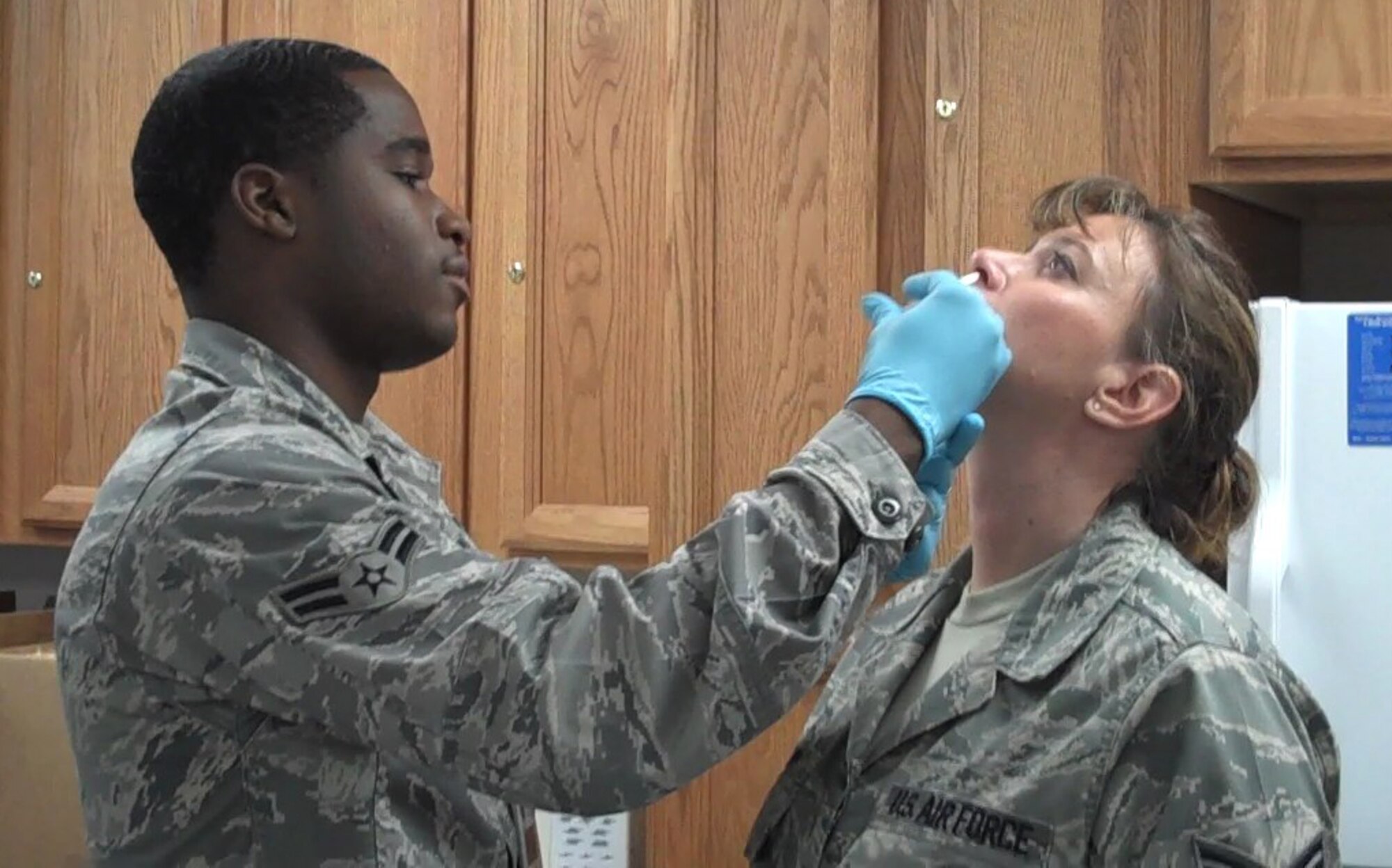 SEYMOUR JOHNSON AIR FORCE BASE, N.C. -- Airman First Class Brandon Young gives the flu mist to another Air Force Reservist during the September unit traininng assembly here. U.S. Air Force photo by TSgt. Scotty Sweatt, 916ARW/PA