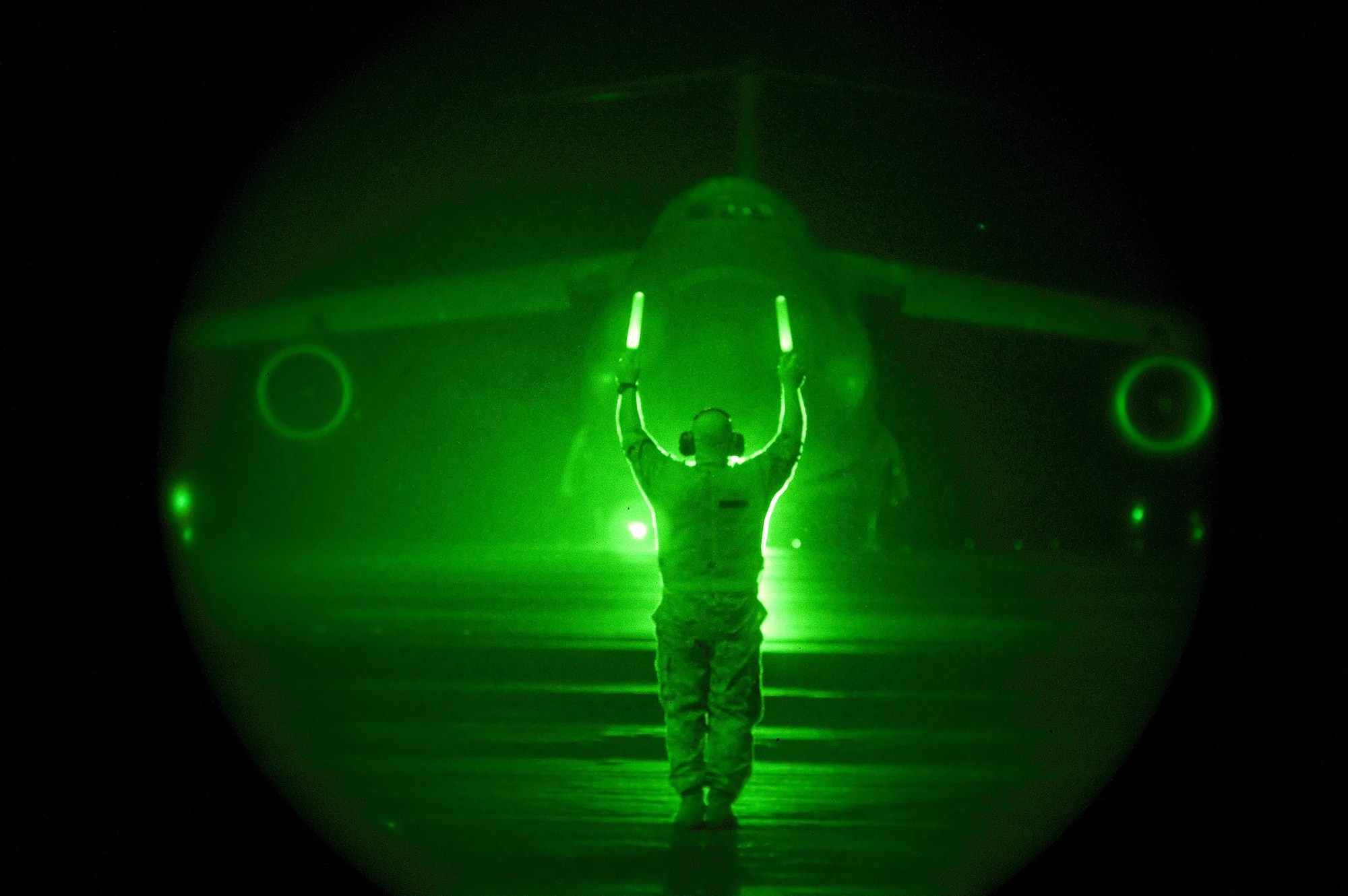 Master Sgt. Richard Biasi, 512th Aircraft Maintenance Squadron, marshals a C-5M Super Galaxy moments before a historical take off. A Team Dover aircrew onboard "The Spirit of Normandy," unofficially set 41 records in a single flight Sept. 13. The certified results are expected to be released in about a month. (U.S. Air Force photo/Jason Minto)