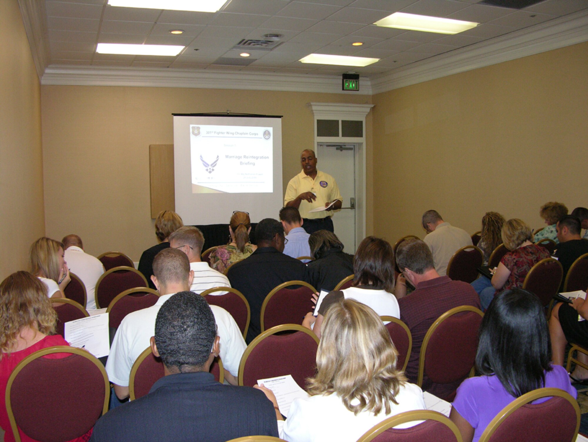 The available seminars gave attendees a variety of topics led by knowledgeable individuals like Major Nathaniel Powell (speaking at left). There were many opportunities for questions and one-on-one support during the 301st Fighter Wing's inaugural Yellow Ribbon Reintegration Program. (U.S. Air Force photo/MSgt Shawn David McCowan)