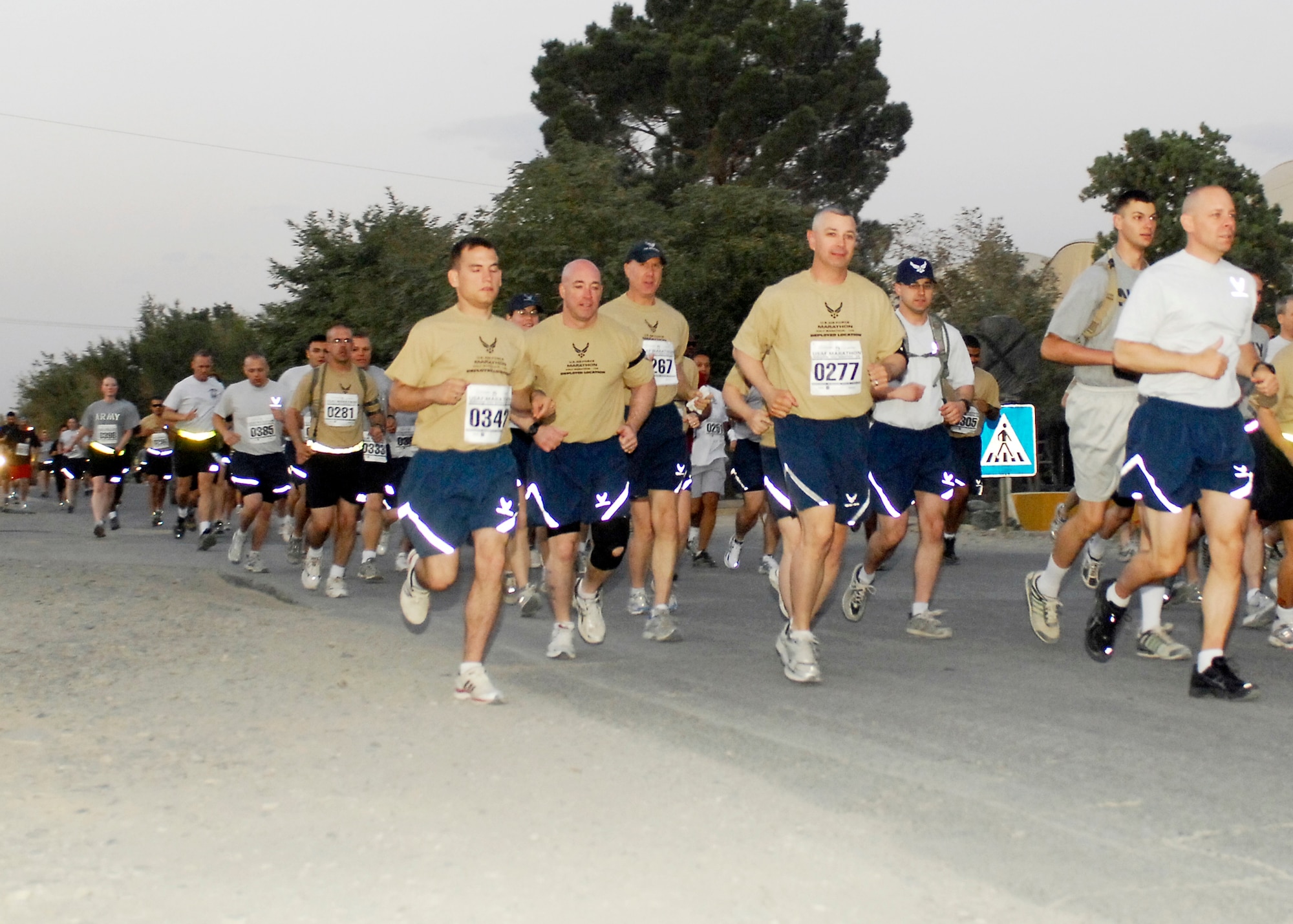 BAGRAM AIRFIELD, Afghanistan -- More 700 Airmen, Soldiers, Sailors and Marines ran in the thirteenth annual Air Force Marathon here, Sept. 13, 2009.  The AF Marathon is held to commemorate our rich history in flight; each year one aircraft is chosen to be highlighted during the marathon and on the unique finisher's medal presented to each race participant.  This year each participant's medal featured a RQ-4 Global Hawk.  (U.S. Air Force photo/Senior Airman Felicia Juenke)