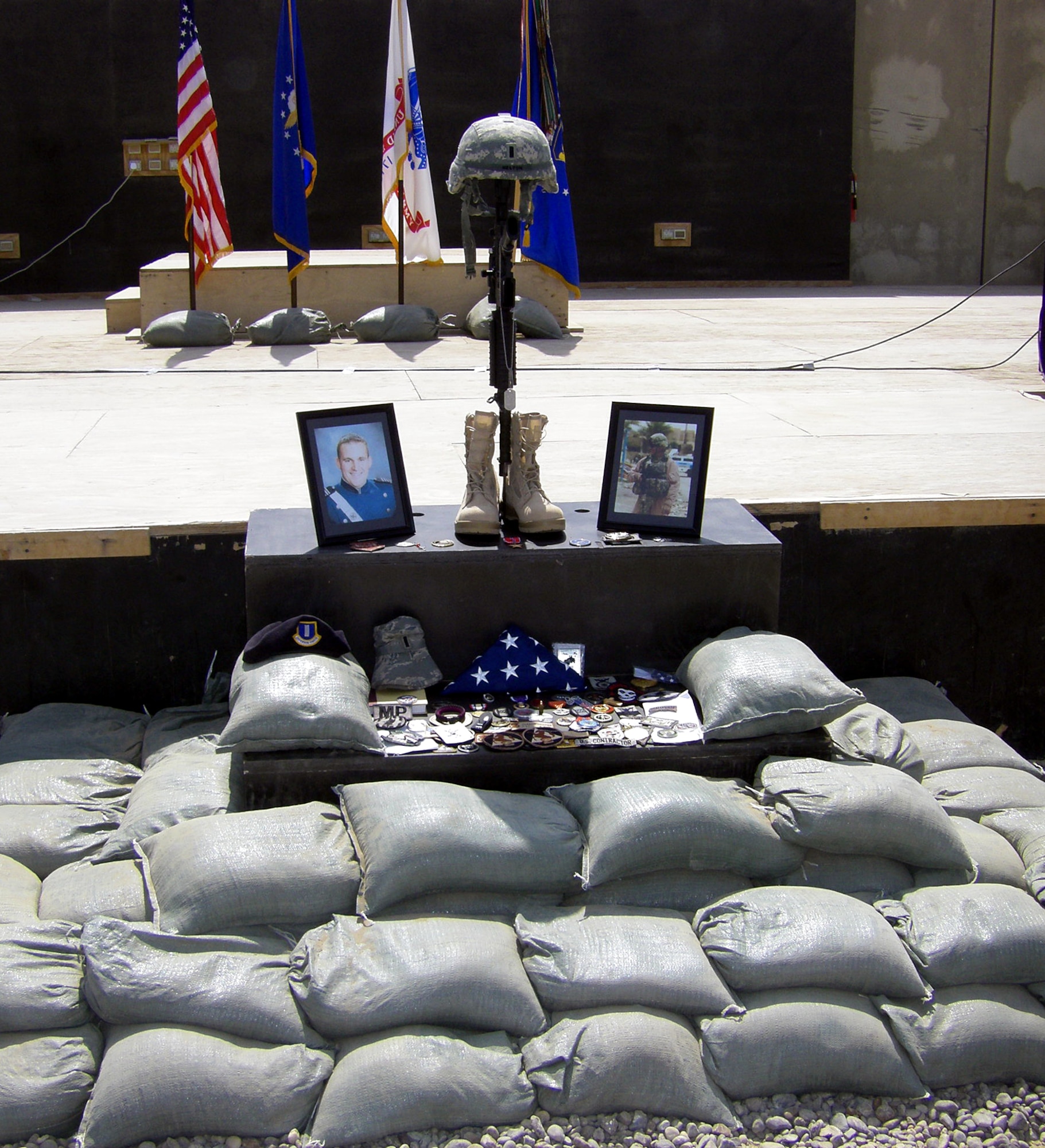 CAMP STRYKER, Iraq -- Numerous items were placed at the tribute during the Sept. 12 memorial ceremony for 1st Lt. Joseph D. Helton Jr., 732d Expeditionary Security Forces Squadron, Detachment 2 flight commander, who perished when a roadside bomb detonated close to his vehicle near Baghdad Sept. 8.  (U.S. Air Force photo/Senior Master Sgt. Matthew Blair)