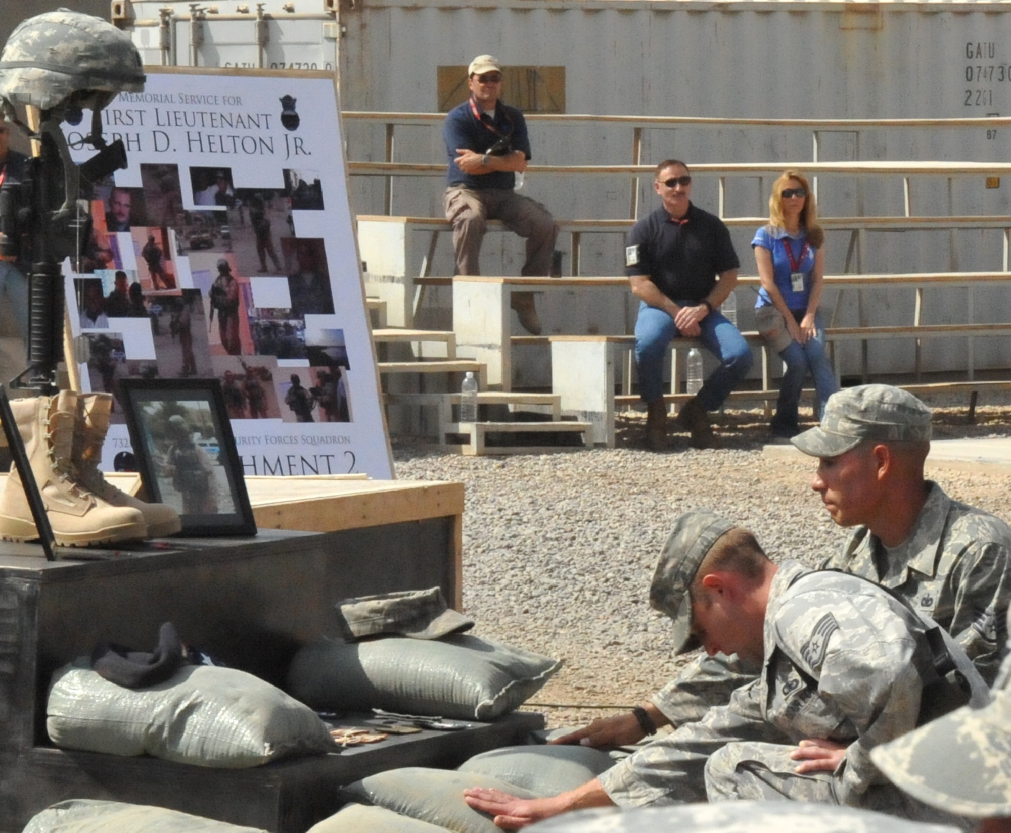 CAMP STRYKER, Iraq -- Members from the 732d Expeditionary Security Forces Squadron Detachment 2 pay their respects during a memorial service for 1st Lt. Joseph D. Helton Jr. Sept.12.  Lieutenant Helton was killed in action when a roadside bomb blasted close to his vehicle Sept. 8.  He is the first security forces officer to have died in the wars in Iraq and Afghanistan. (U.S. Air Force photo/Staff Sgt. Misty D. Slater)


