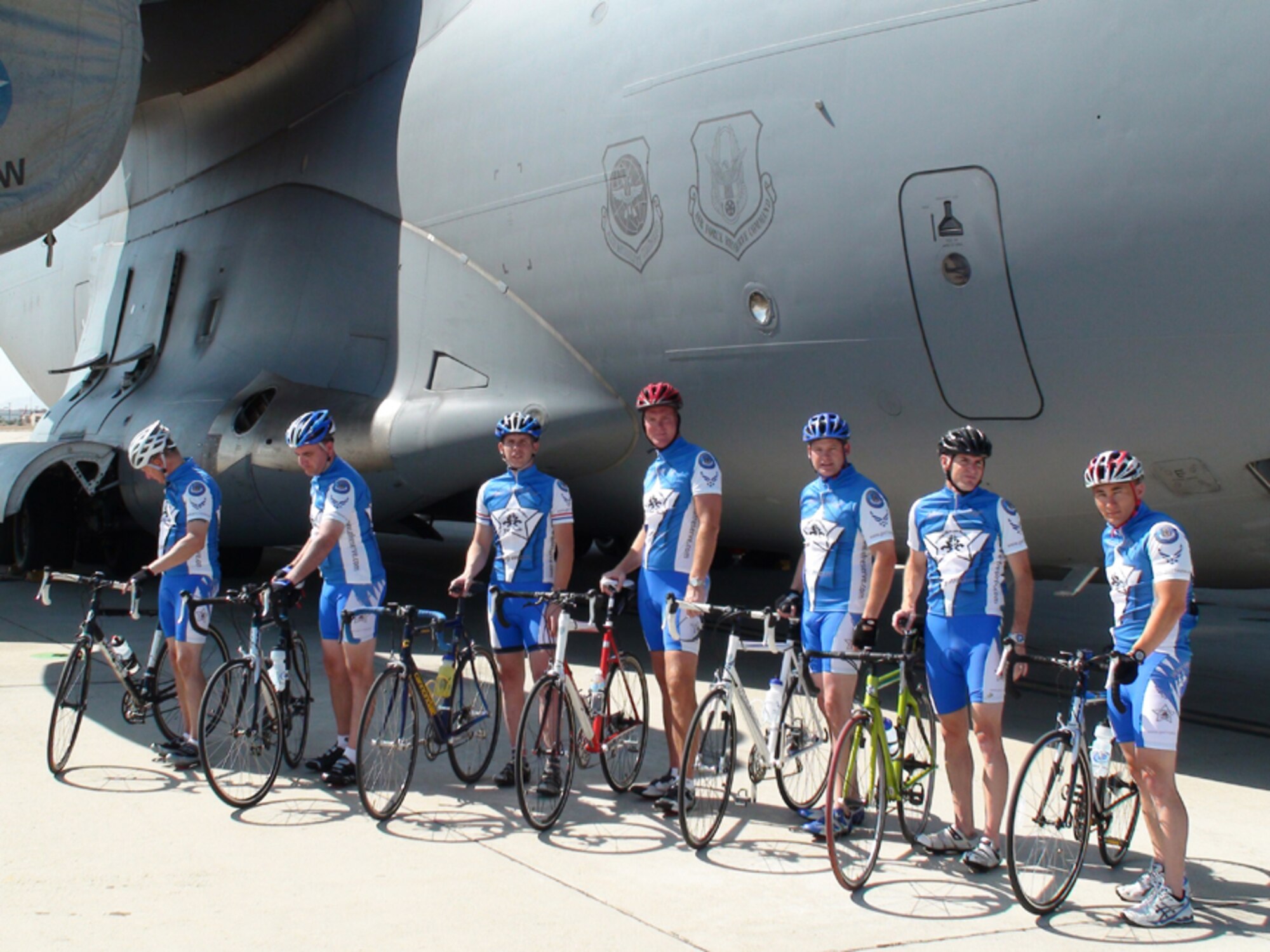 Cyclists from the Western Recruiting Squadron pose for a group portrait next to one of the C-17s at March ARB. The group rides together recreationally about twice a month, as well as participating in cycling events such as the Tour de Cure. The cyclists used their own money to purchase their matching jerseys, which helps their recruiting website get exposure as they ride together. (Left-right) Senior Master Sgt. Marvin J. Greene, NCOIC Operations; Chief Master Sgt. Steven Perrault, Western Recruiting Superintendent; Master Sgt. Kenneth Helgeson, 1st Sergeant; Senior Master Sgt. Mark Scully, March ARB Assistant Senior Recruiter; Chief Master Sgt. Patrick Wood, Western Recruiting Analysts; Master Sgt. William Rule, Western Recruiting Analysts; Capt. Ross Vedder, Jr., Operations Officer. (U.S. Air Force photo by MSgt Mike Blair)

