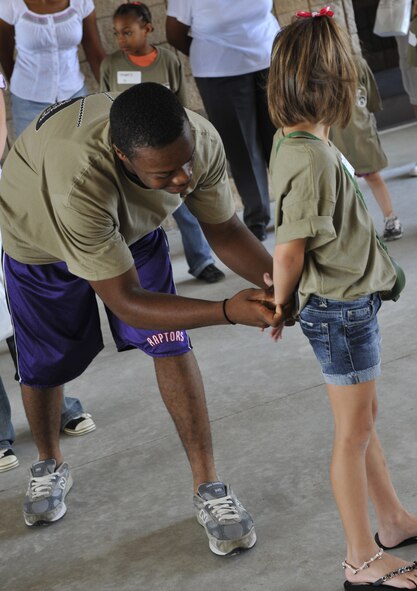MOODY AIR FORCE BASE, Ga. -- Family members participate in the kids’ deployment line here Sept. 12. The children were able to experience the process of going through a deployment line, receive briefings, giveaways and a static display. (U.S. Air Force photo by Senior Airman Schelli Jones)