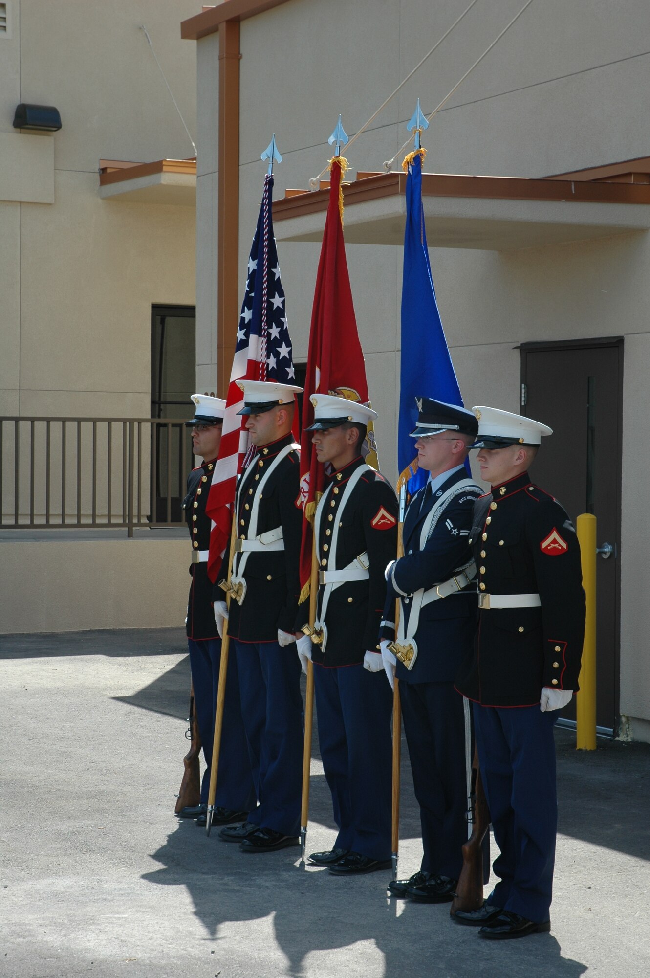 Members of a joint force honor guard render colors Sept. 12 during a ribbon cutting of the new home of the Marine Corp's 6th Engineer Support Battalion Bulk Fuel Charlie Company. (U.S. Air Force photo/Senior Airman Andre Bowser)