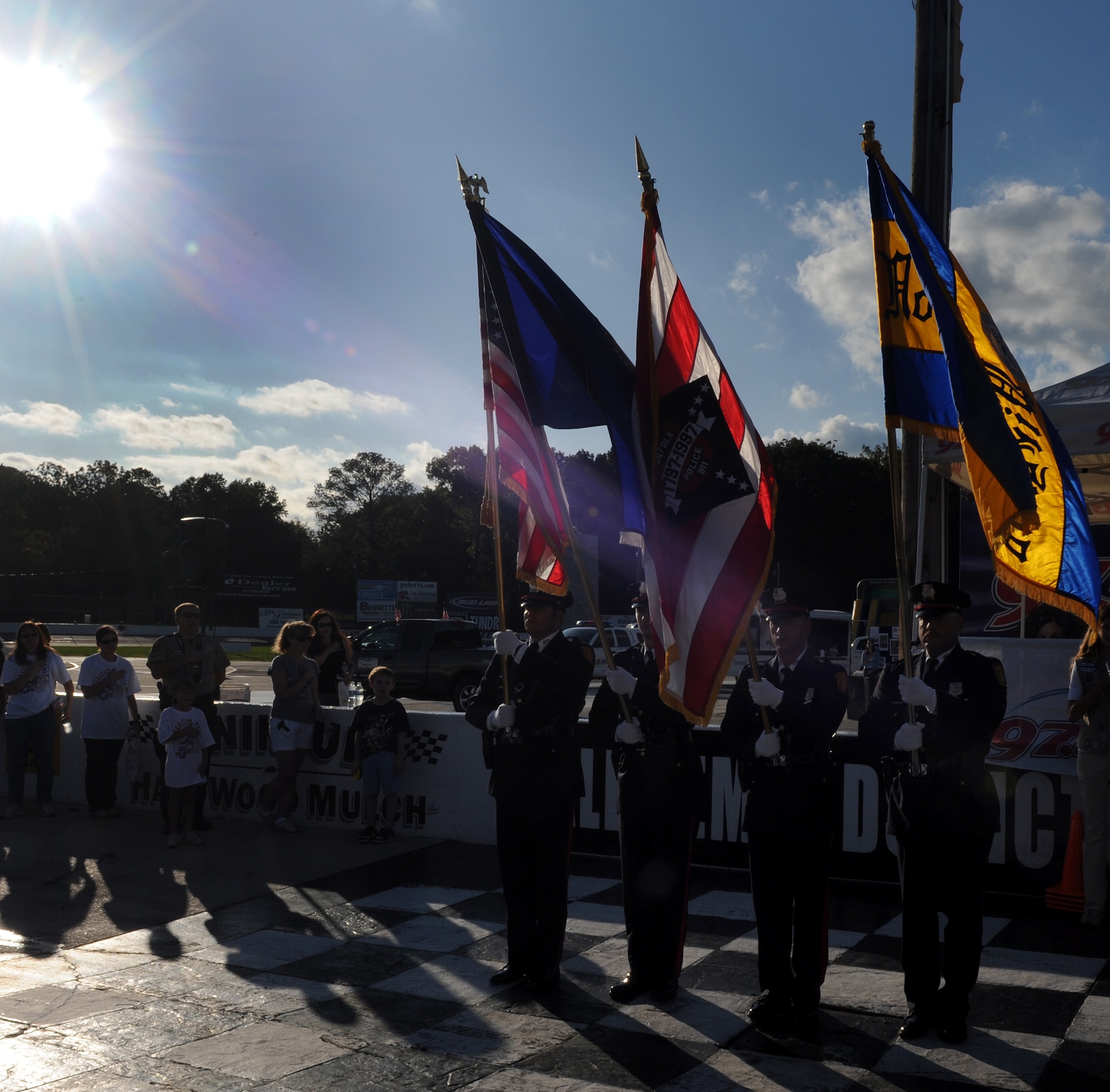 LANGLEY AIR FORCE BASE, Va. --  Members of the Norfolk Police Department Honor Guard present the colors while the National Anthem plays during Freedom Walk at Langley Speedway Sept. 11. Freedom Walk was held in remembrance of those lost during 9/11 terrorist attacks and to honor our military members and first responders.  (U.S. Air Force photo/Senior Airman Zachary Wolf)

