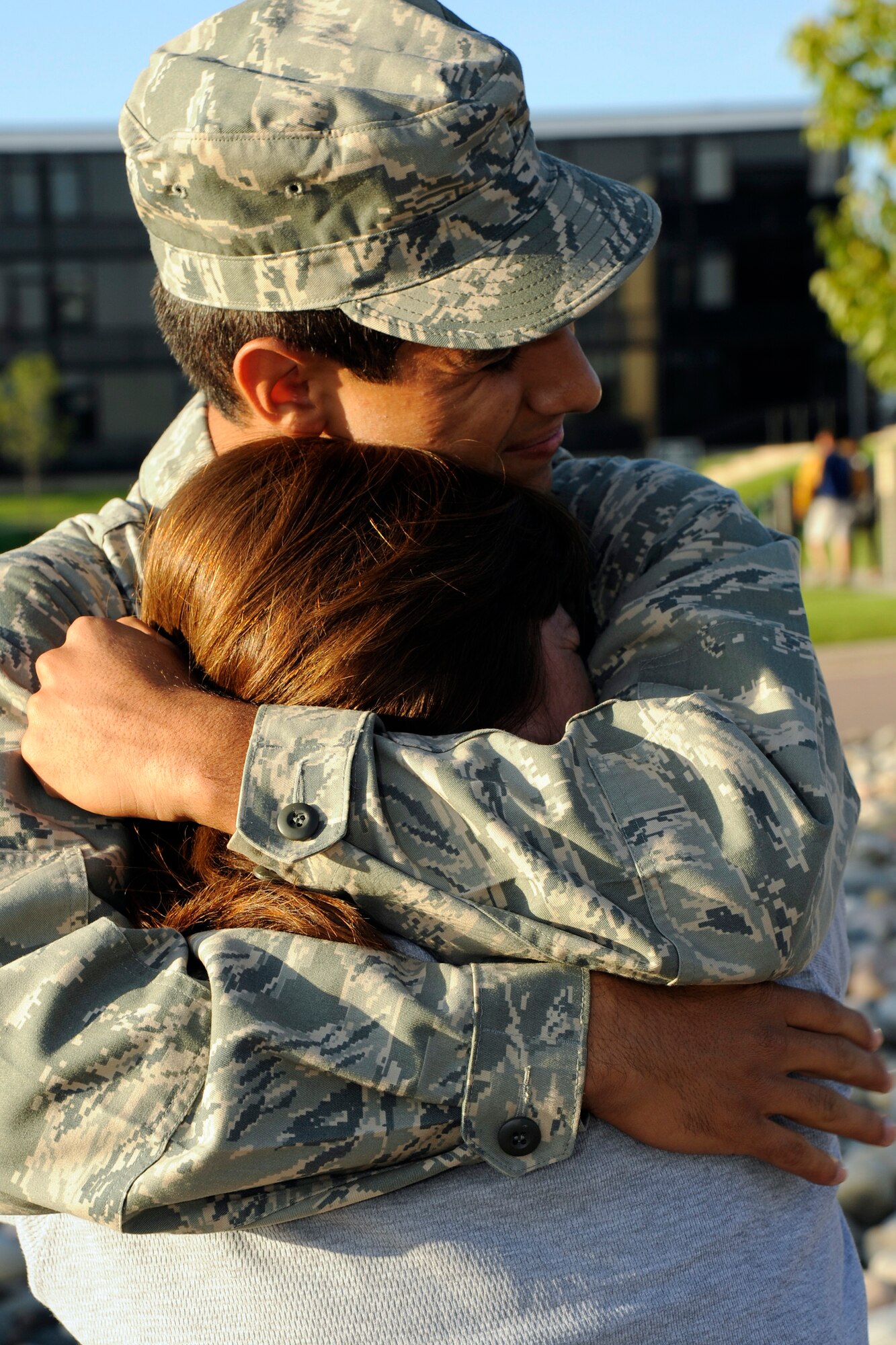 Prep School Cadet Candidate Clinton Ramos greets his mother, Lisa, with a big hug at the start of Parents' Weekend Sept. 4, 2009. Cadet Candidate Ramos is a Dallas native. (U.S. Air Force photo/Dave Ahlschwede)