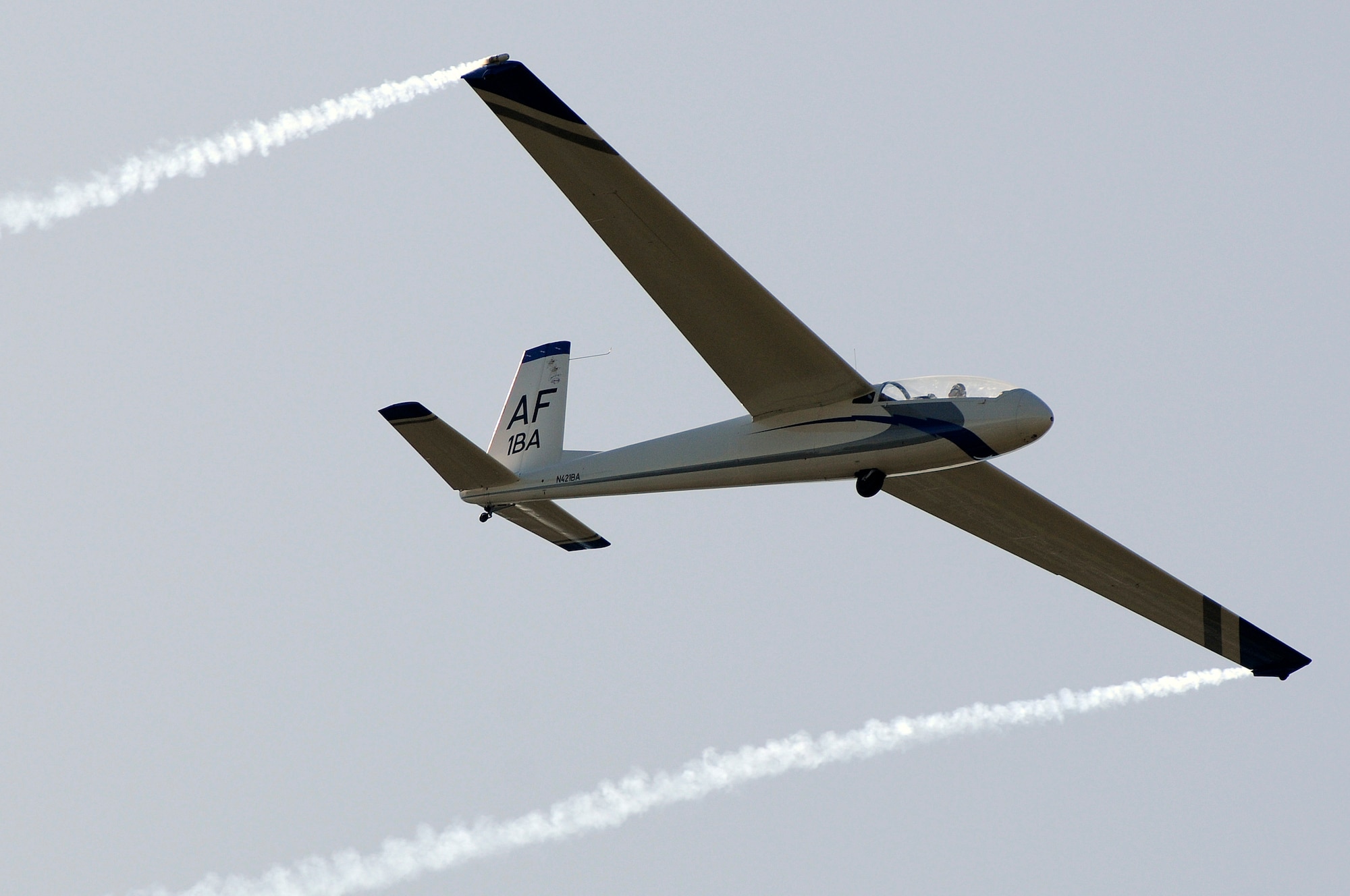 A TG-10 Charlie glider flies over Stillman Field prior to a cadet parade Sept. 4, 2009. The flyer was part of a glider demonstration for Parents' Weekend. A four-ship flight of F-15 Eagles also flew over the parade. (U.S. Air Force photo/Mike Kaplan)
