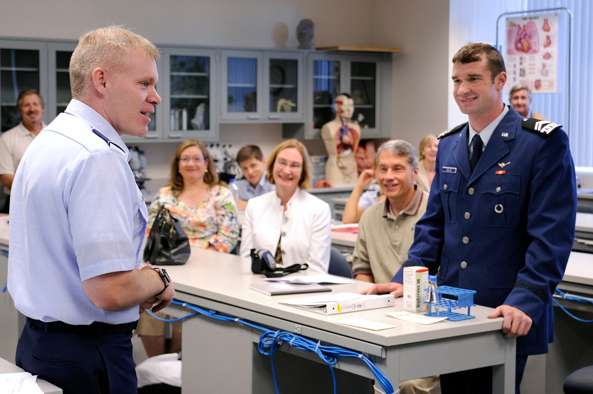 Cadet 2nd Class Michael Cello and his family receive a briefing from biology instructor Lt. Col. Leon Barringer before a laboratory experiment Sept. 4. Families got to sit in classes with their cadets as part of Parents' Weekend. (U.S. Air Force photo/Mike Kaplan)