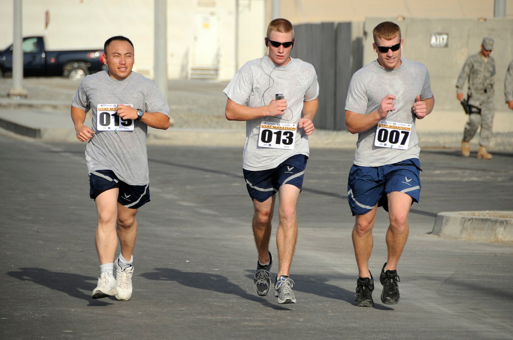 SOUTHWEST ASIA – 380th Air Expeditionary Wing Airmen run towards the half-marathon finish line during the 13th Annual Air Force Marathon here Sept. 13. More than 100 Airmen and Soldiers participated in the event. (U.S. Air Force photo/Senior Airman Stephen Linch)