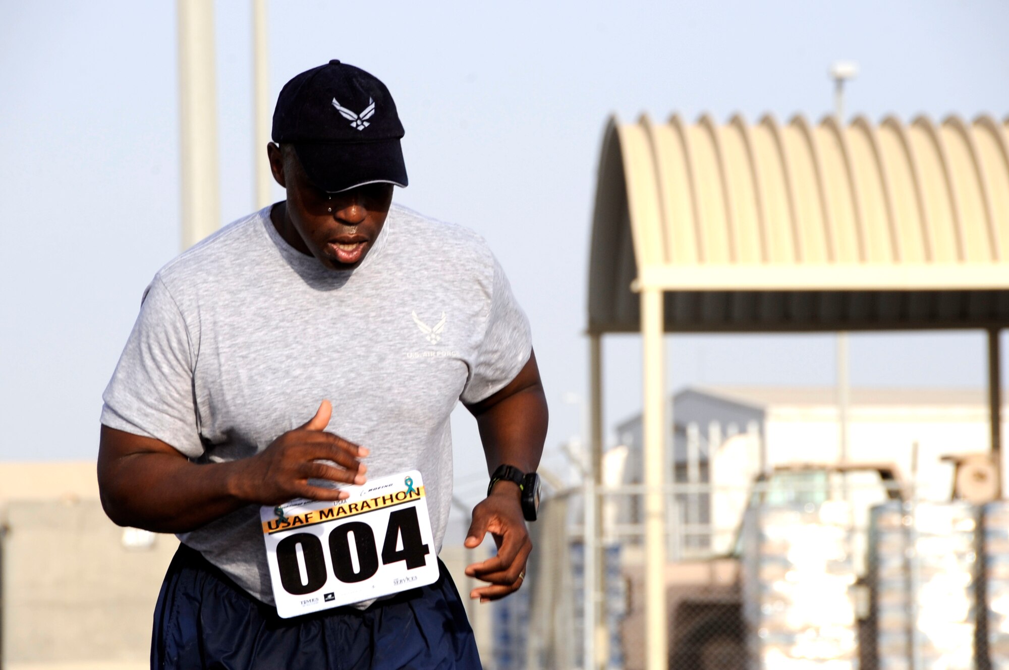 SOUTHWEST ASIA – Master Sgt. Stacey Fields, 380th Air Expeditionary Wing Finance Office, runs to the half-marathon finish line during the 13th Annual Air Force Marathon here Sept. 13. Sergeant Fields is deployed from Kadena Air Base, Japan and grew up in Monroe, La. (U.S. Air Force photo/Senior Airman Stephen Linch)