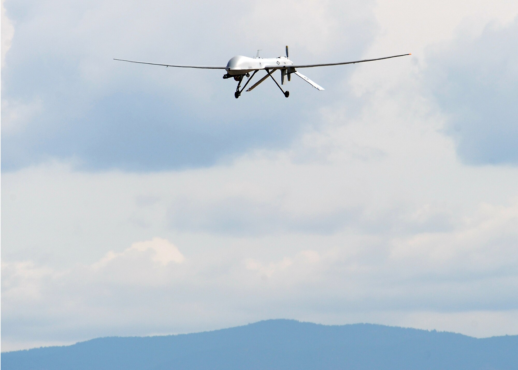 HOLLOMAN AIR FORCE BASE, N.M. -- An MQ-1 Predator returns to the base after its first official flight Sept. 10. With the flight, the 432nd Wing, Detachment 5, reached initial operational capacity at Holloman. (U.S. Air Force photo by Senior Airman Michael Means)