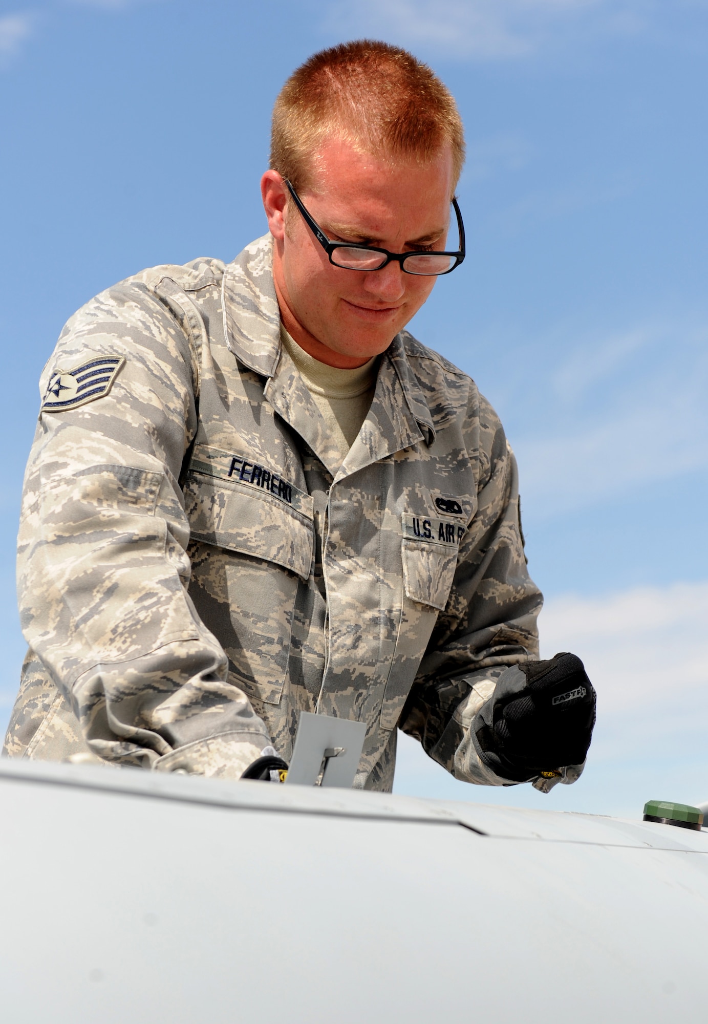 HOLLOMAN AIR FORCE BASE, N.M. -- Staff Sgt. Clifford Ferrero, 432nd Maintenance Group, Detachment 1, inspects the MQ-1 Predator after it landed here Sept. 10 from its first official flight out of the base. With the flight, the 432nd Wing, Detachment 5, reached initial operational capacity at Holloman. (U.S. Air Force photo by Senior Airman Michael Means)