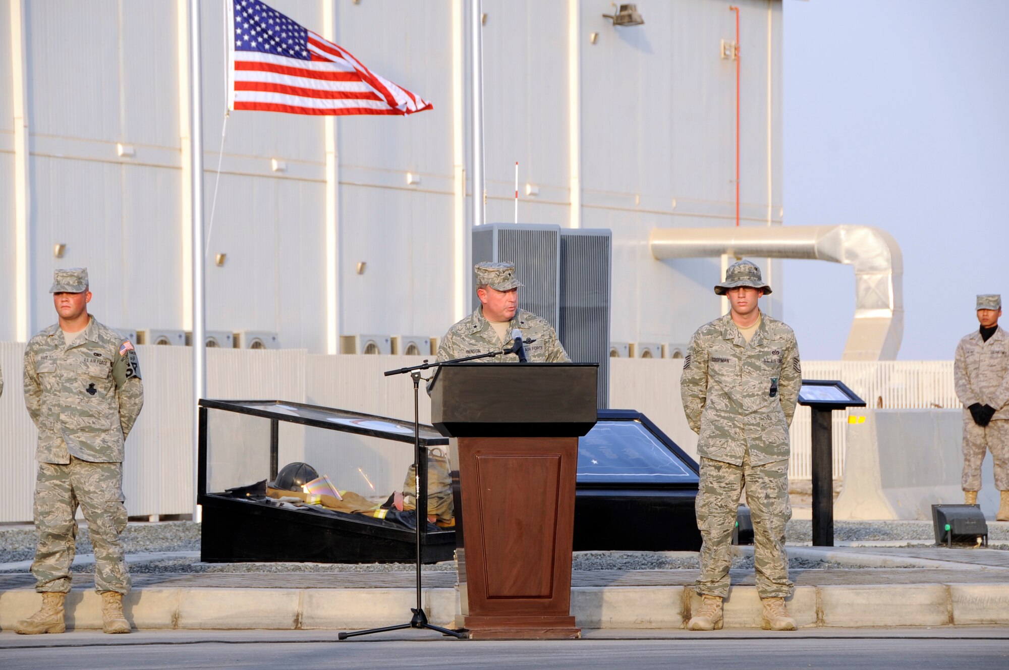 SOUTHWEST ASIA – Brig. Gen. Bryan Benson, 380th Air Expeditionary Wing commander, gives a speech during a commemoration ceremony here on the eighth anniversary of Sept. 11, 2001. The 380th AEW’s Sept. 11 Memorial took the two teams almost two months to construct, and collectively more than 1,000 hours to build.  (U.S. Air Force photo/Senior Airman Stephen Linch)