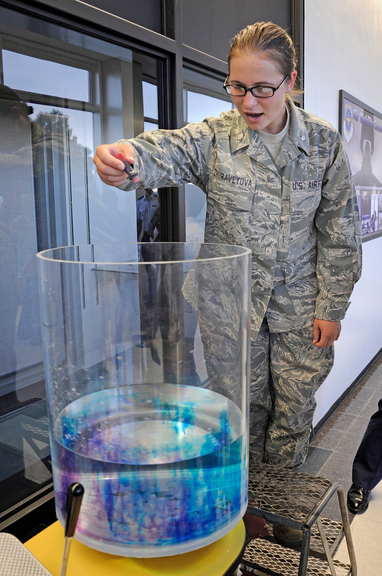 Cadet Candidate Anatasia Zhuravlyova drops food dye into a display during Majors Night Sept. 9, 2009. (U.S. Air Force photo/Mike Kaplan)