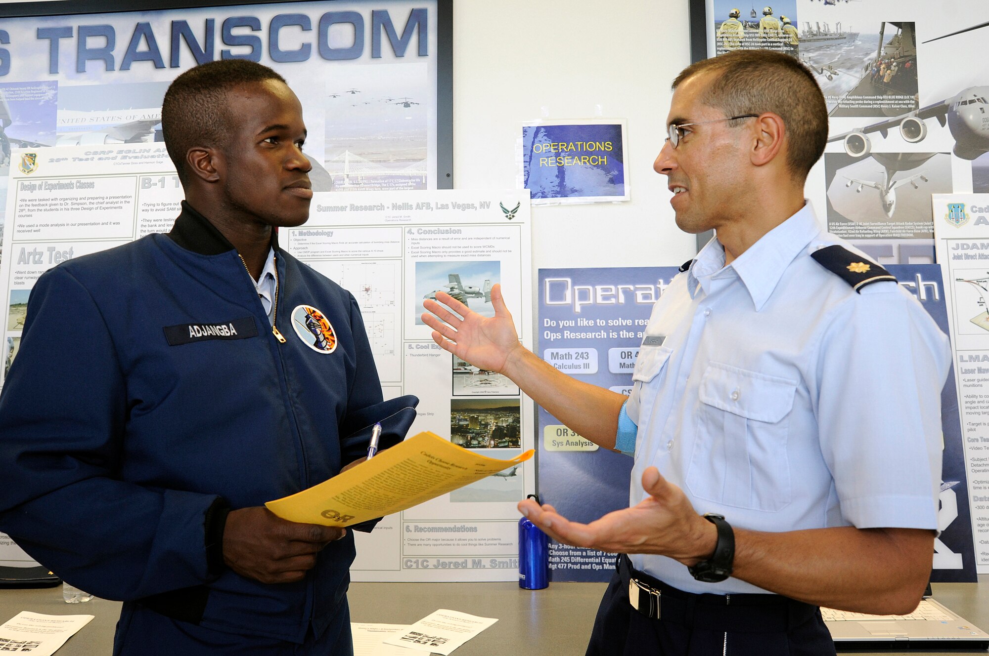 Maj. Leonard Cabrera speaks with Cadet 4th Class Daniel Adjangba during Majors Night at the U.S. Air Force Academy Sept. 9, 2009. Major Cabrera is an assistant professor with the Department of Economics and Geosciences. (U.S. Air Force photo/Mike Kaplan)