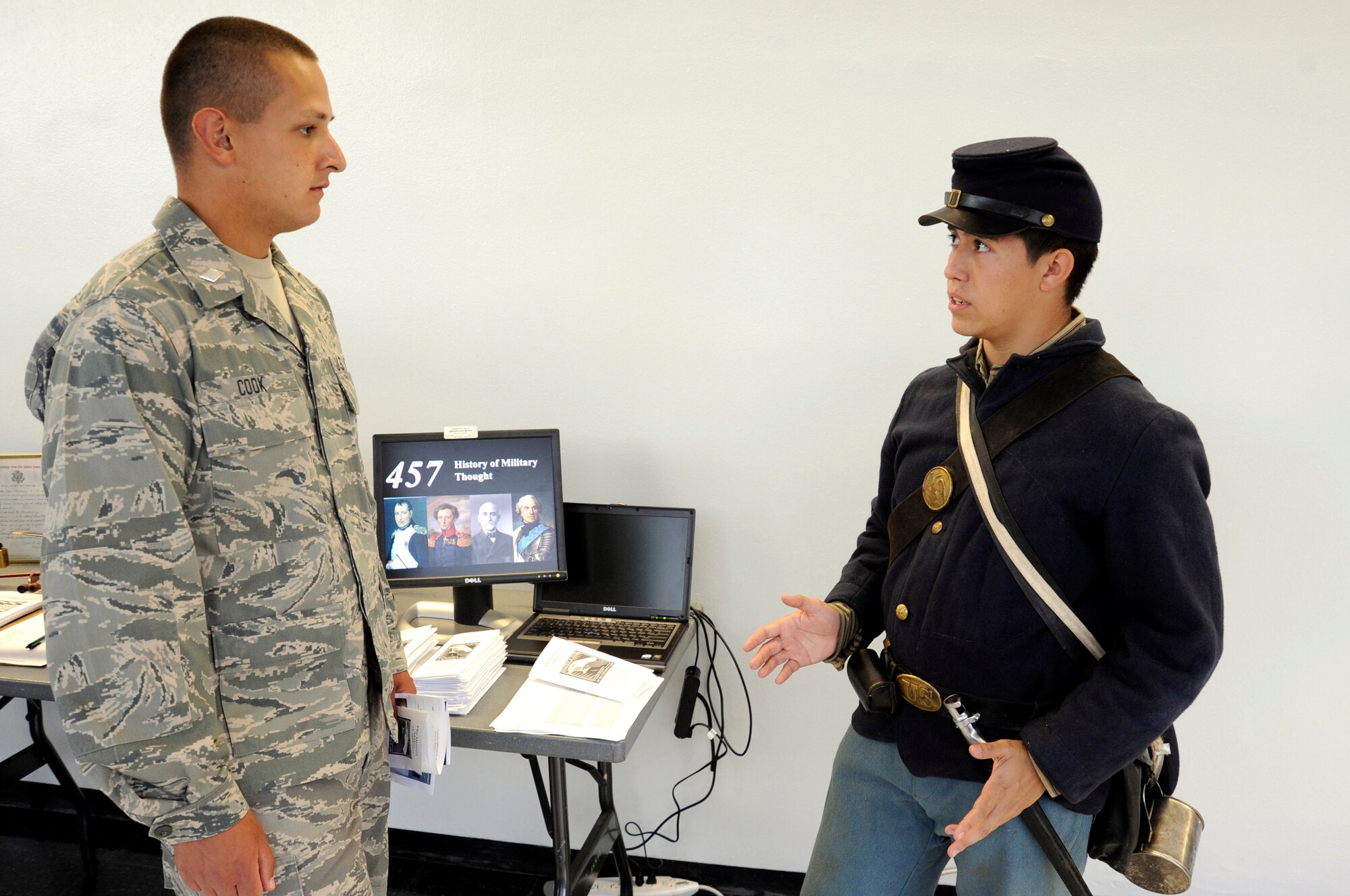 Cadet 1st Class Shea Speer speaks with Cadet Candidate Richard Cook about the U.S. Air Force Academy's history program during Majors Night Sept. 9, 2009. (U.S. Air Force photo/Mike Kaplan)