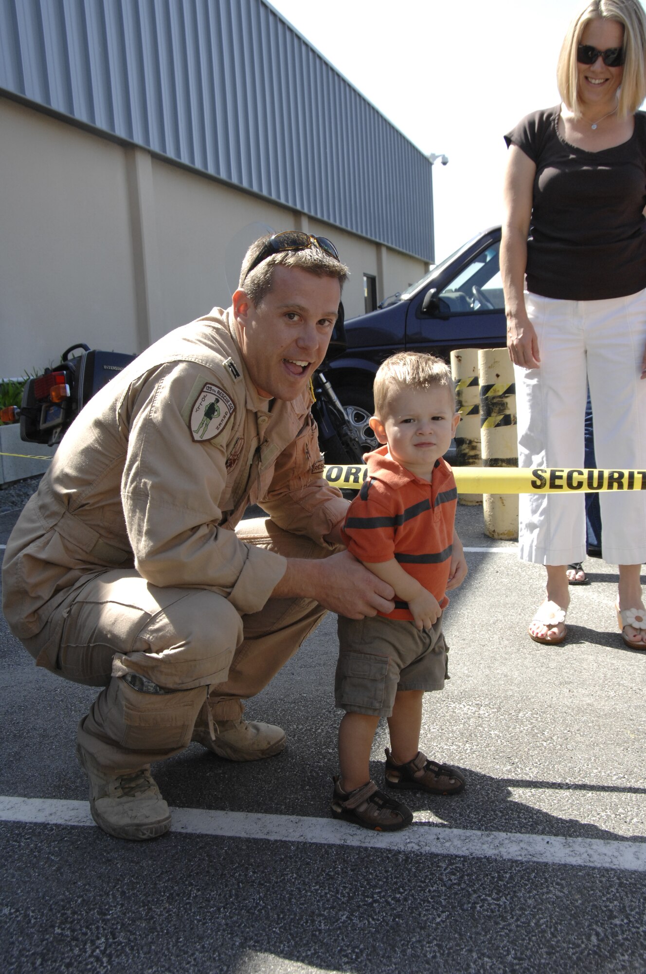 Capt. Nate Nowaski, an HH-60G Pave Hawk helicopter pilot from the 129th Rescue Squadron, is reunited with his son at Moffett Federal Airfield, Calif., after returning home from a four-month deployment to Afghanistan, Sept. 9. (Air National Guard photo by Tech. Sgt. Ray Aquino)