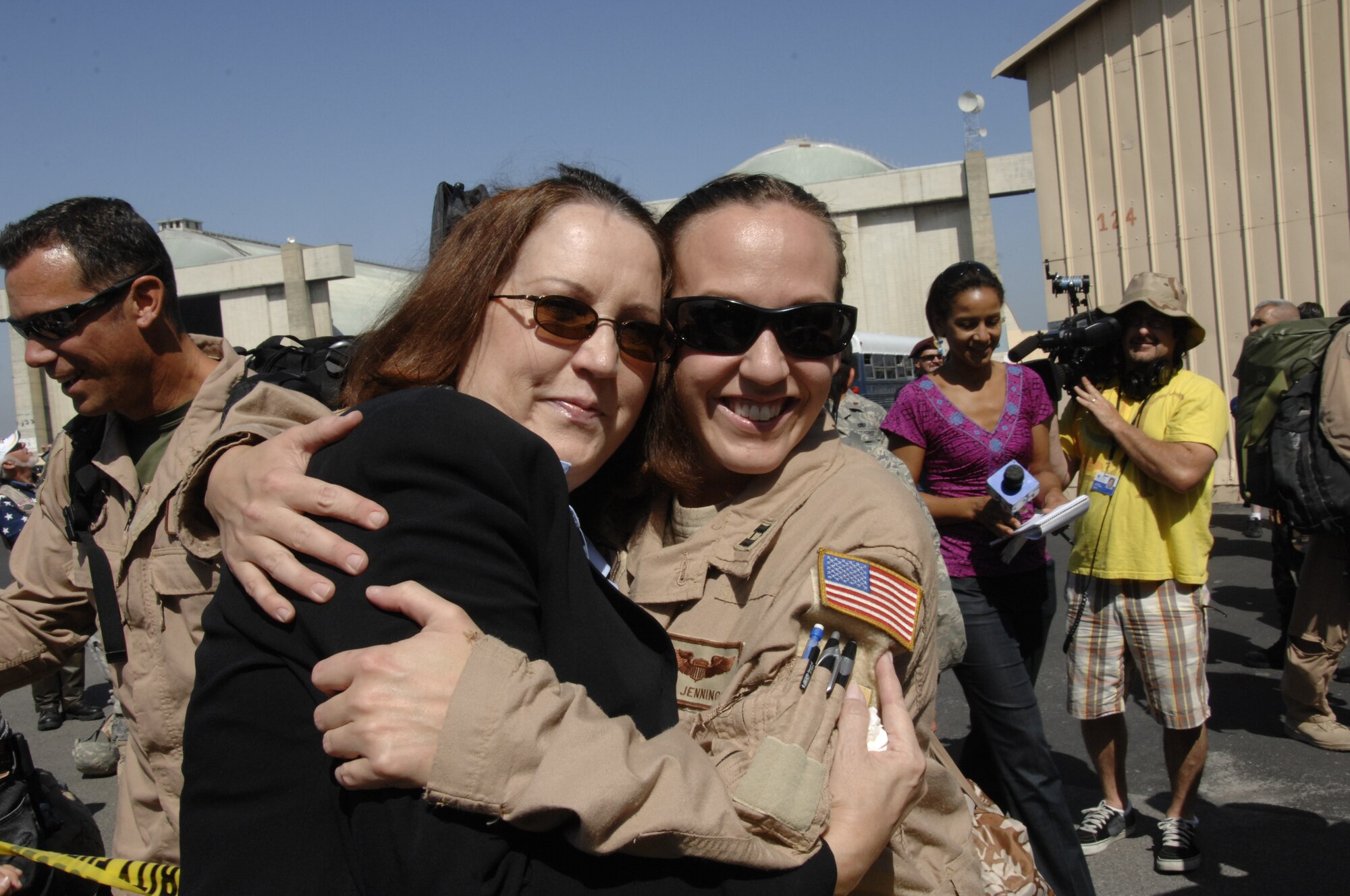 Capt. Mary Jennings, an HH-60G Pave Hawk helicopter pilot from the 129th Rescue Squadron, is greeted by her mom at Moffett Federal Airfield, Calif., after returning home from a four-month deployment to Afghanistan, Sept. 9. (Air National Guard photo by Tech. Sgt. Ray Aquino)