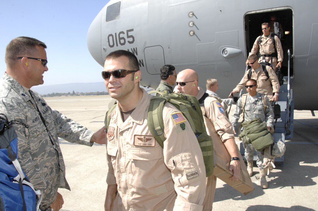 Members from the 129th Rescue Wing are greeted upon their return to Moffett Federal Airfield, Calif., after a four-month deployment to Afghanistan, Sept. 9, 2009.  (Air National Guard photo by Tech. Sgt. Ray Aquino)