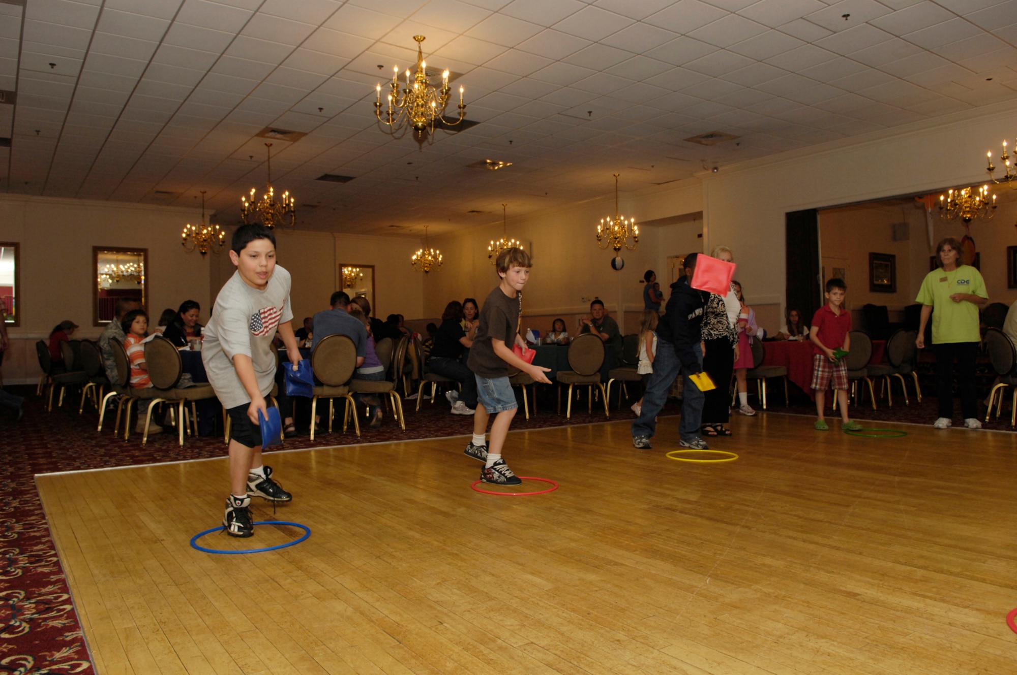 HANSCOM AIR FORCE BASE, Mass. –Children toss beanbags during one of the activities at the 66th Force Support Squadron’s Back to School Blues family night at the Minuteman Club on Sept. 9. The event was well attended by Club members and provided a free family night out complete with buffet, games, activities and giveaways for children and adults. For more information on Club membership or for a list of upcoming activities at the Minuteman Club go to www.hanscomservices.com. (U.S. Air Force photo by Mark Herlihy)